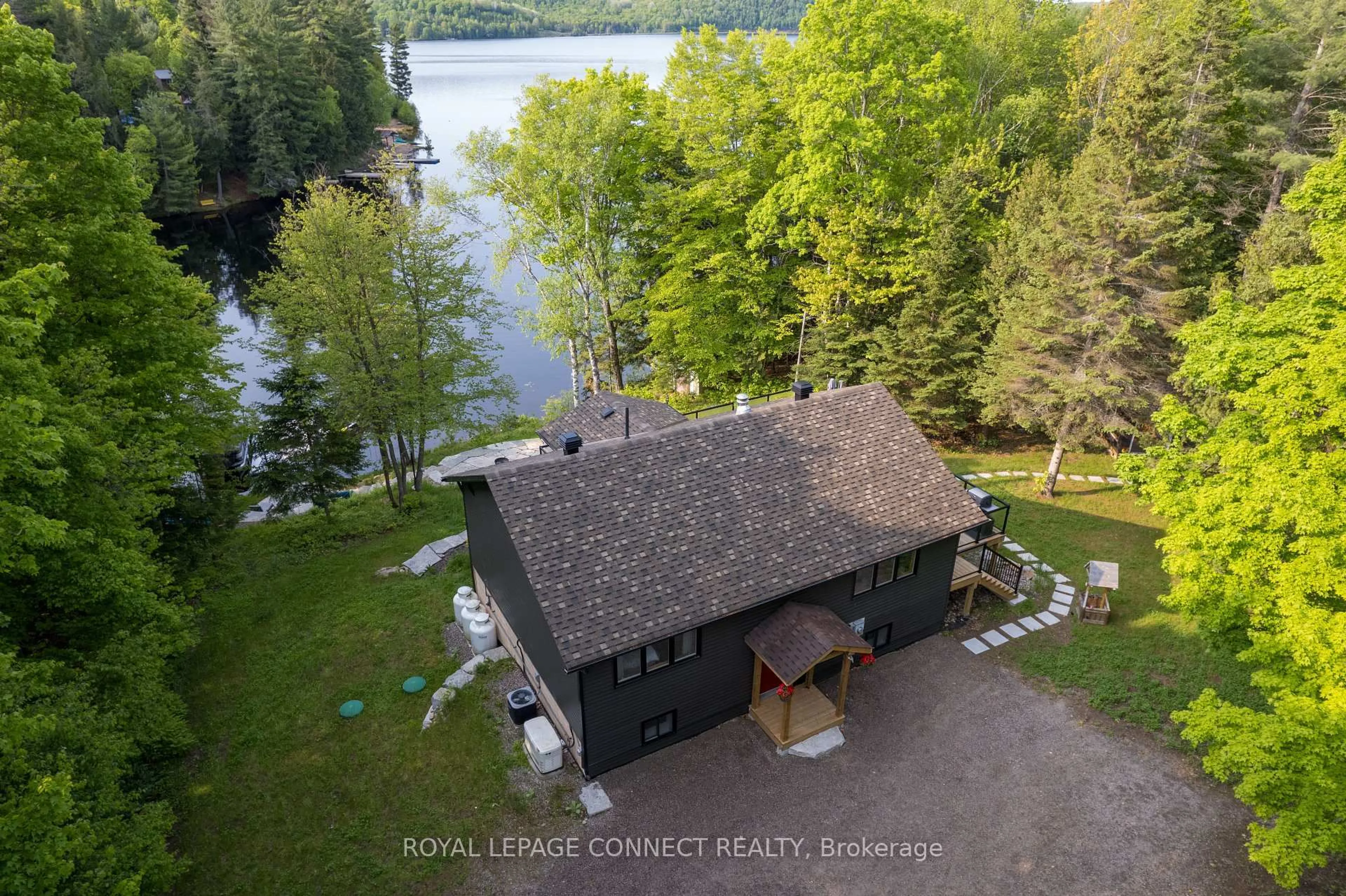 A pic from outside/outdoor area/front of a property/back of a property/a pic from drone, water/lake/river/ocean view for 3 Irwin Lane, Maynooth Ontario K0L 2S0