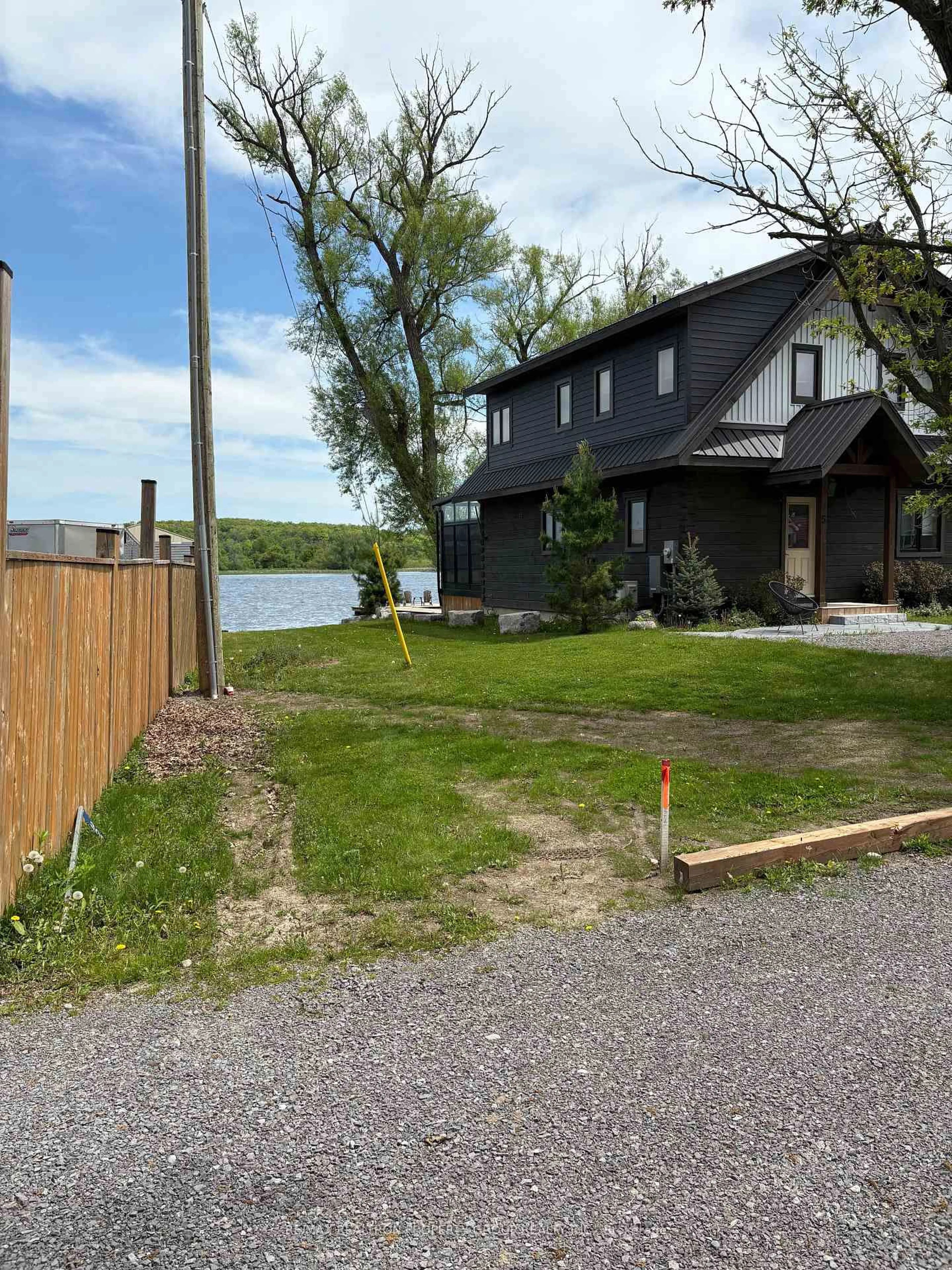 A pic from outside/outdoor area/front of a property/back of a property/a pic from drone, water/lake/river/ocean view for 30E Bass Lane, Trent Hills Ontario K0L 1L0