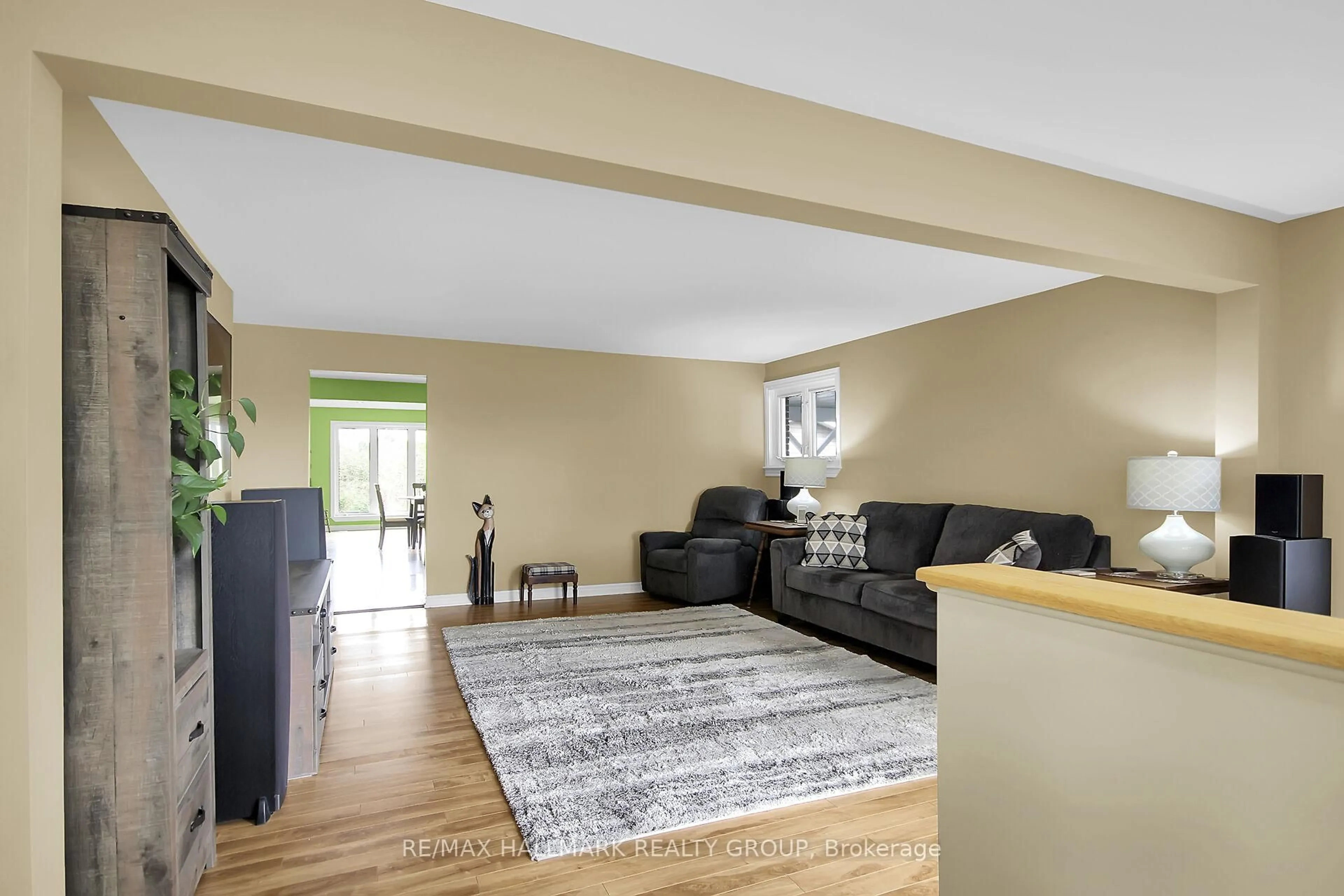 Living room with furniture, wood/laminate floor for 8441 Mitch Owens Dr, Ottawa Ontario K0A 1V0