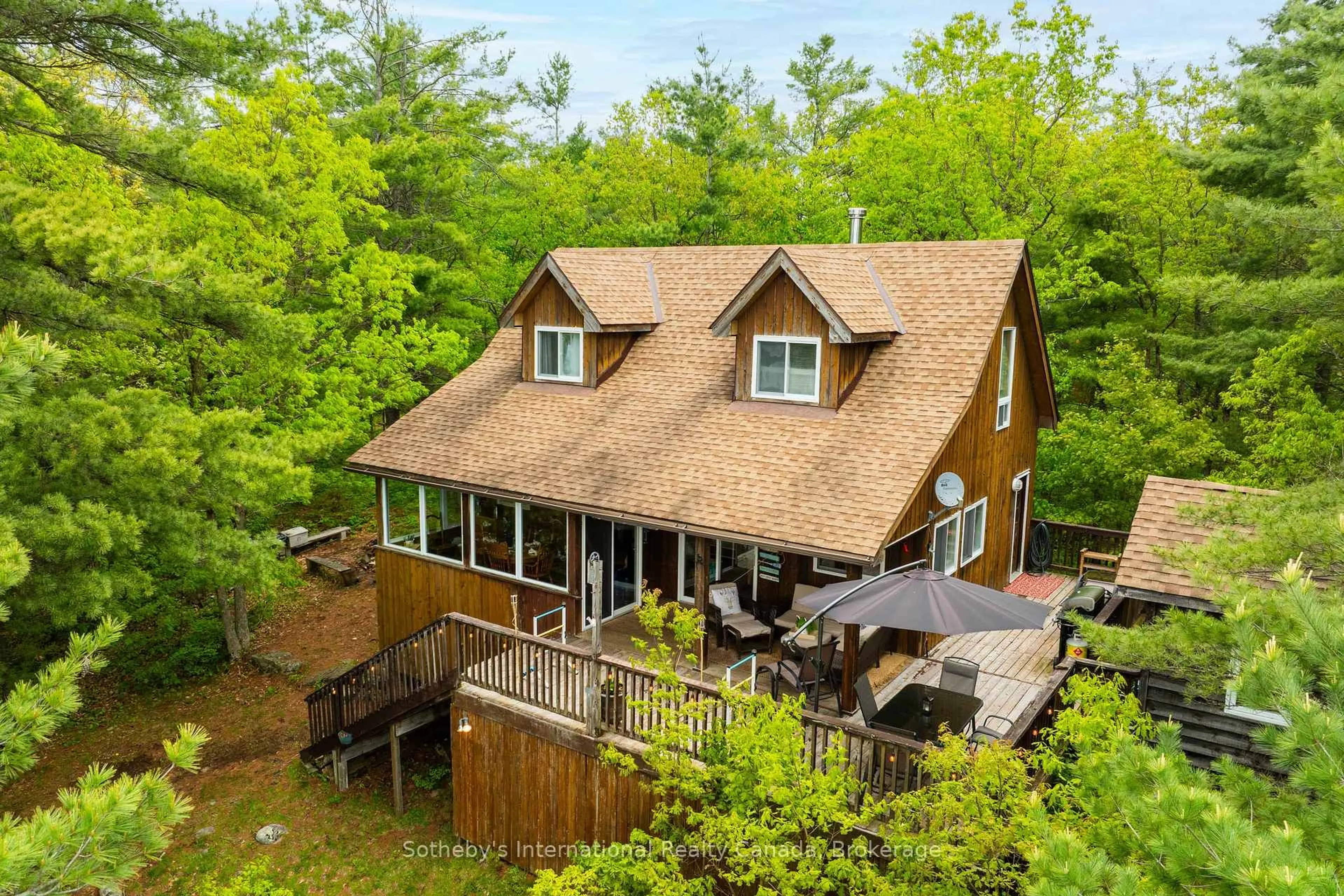 A pic from outside/outdoor area/front of a property/back of a property/a pic from drone, water/lake/river/ocean view for 5760 Kahshe Lake, Gravenhurst Ontario P0E 1G0