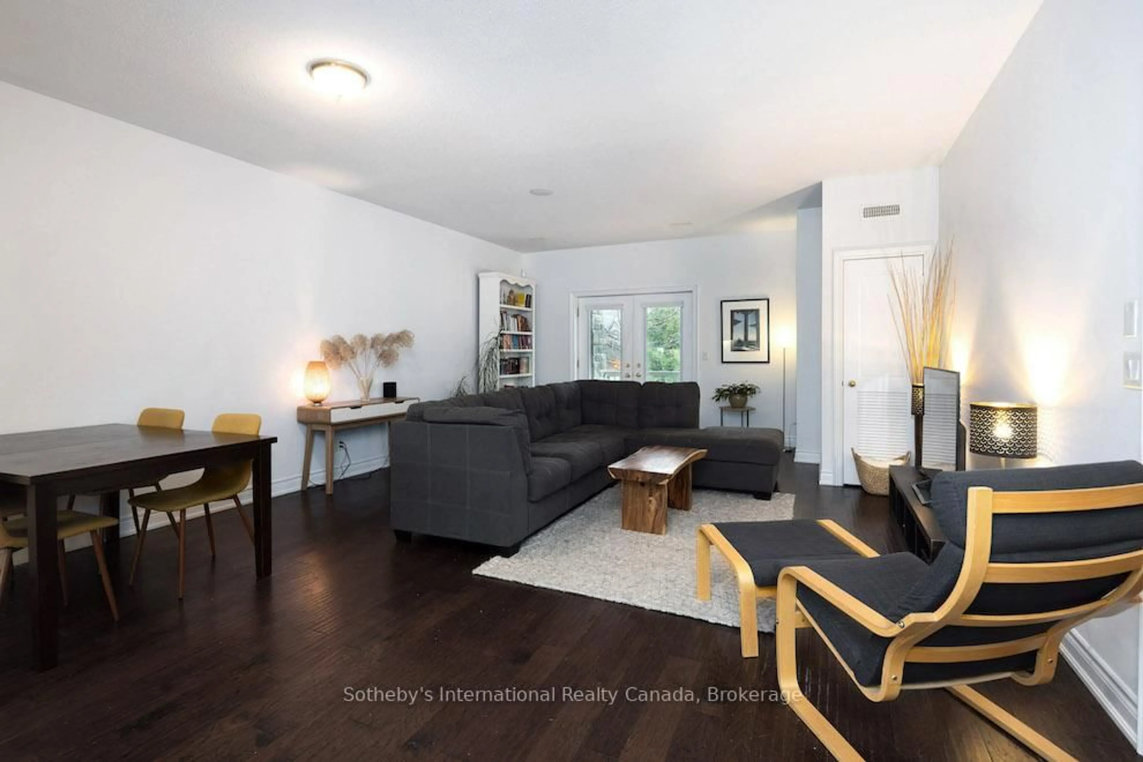 Living room with furniture, wood/laminate floor for 25 Beaver St #107, Blue Mountains Ontario N0H 2P0