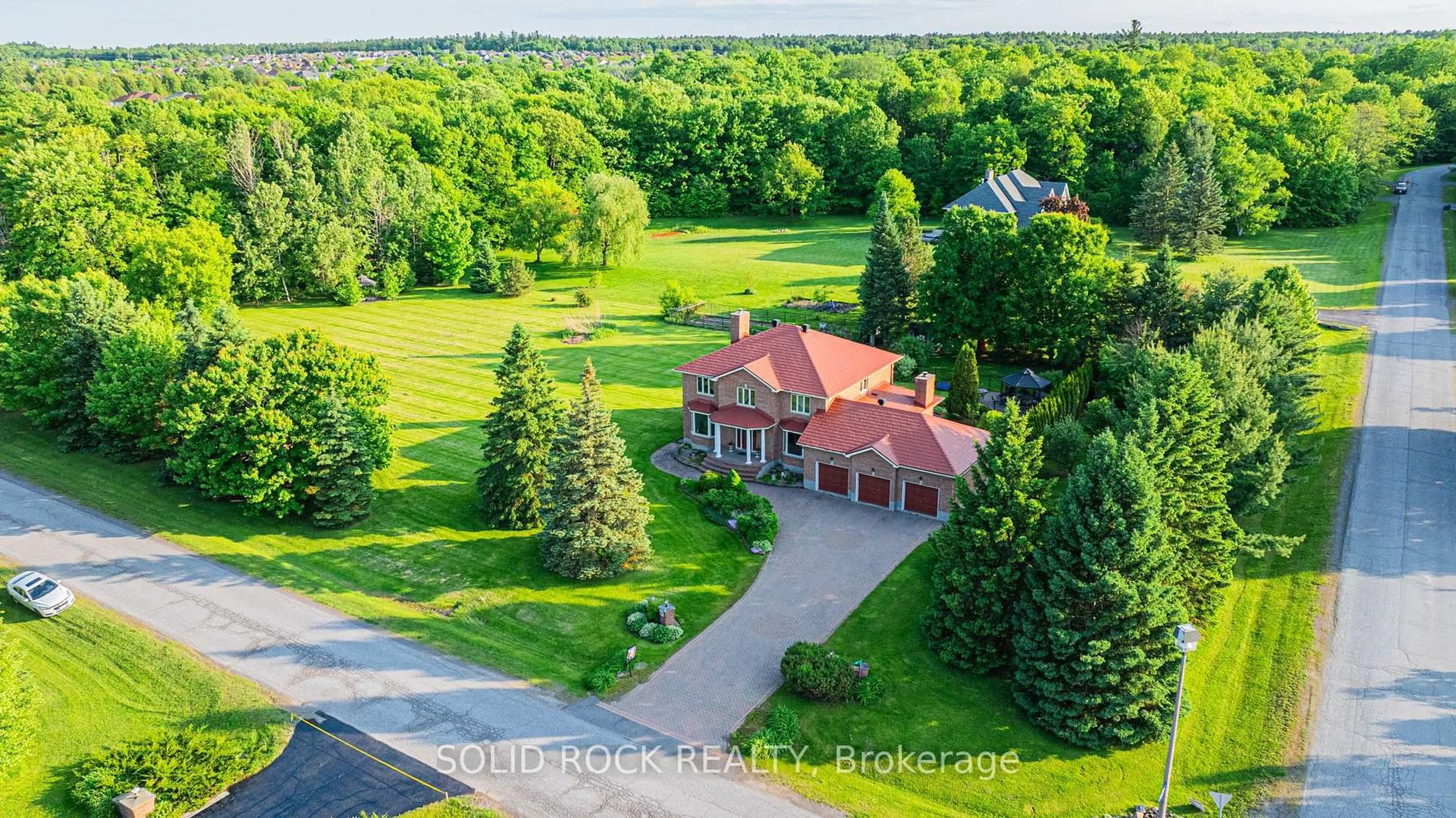 A pic from outside/outdoor area/front of a property/back of a property/a pic from drone, unknown for 42 Marchbrook Circ, Ottawa Ontario K2W 1A1