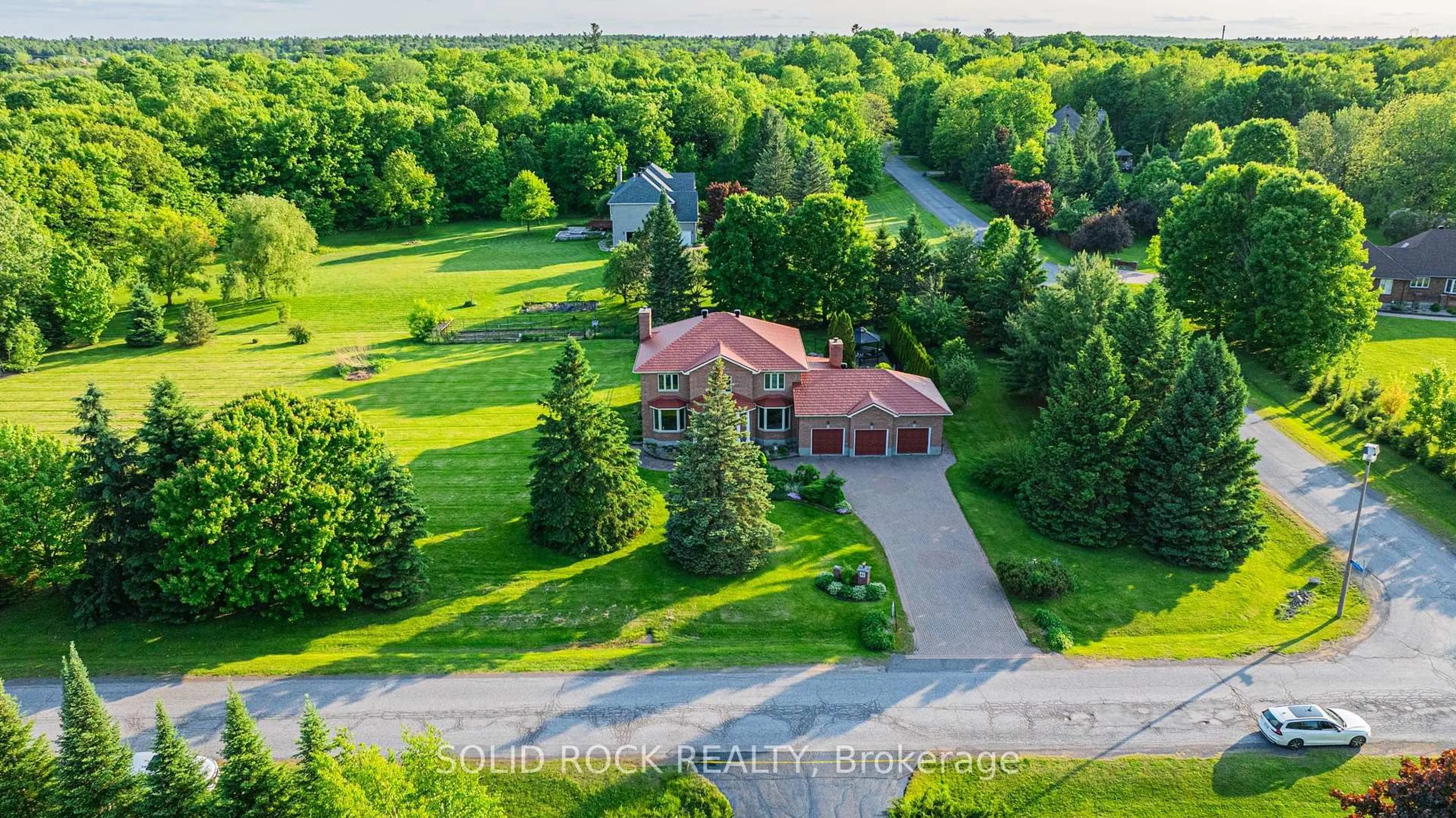 A pic from outside/outdoor area/front of a property/back of a property/a pic from drone, unknown for 42 Marchbrook Circ, Ottawa Ontario K2W 1A1