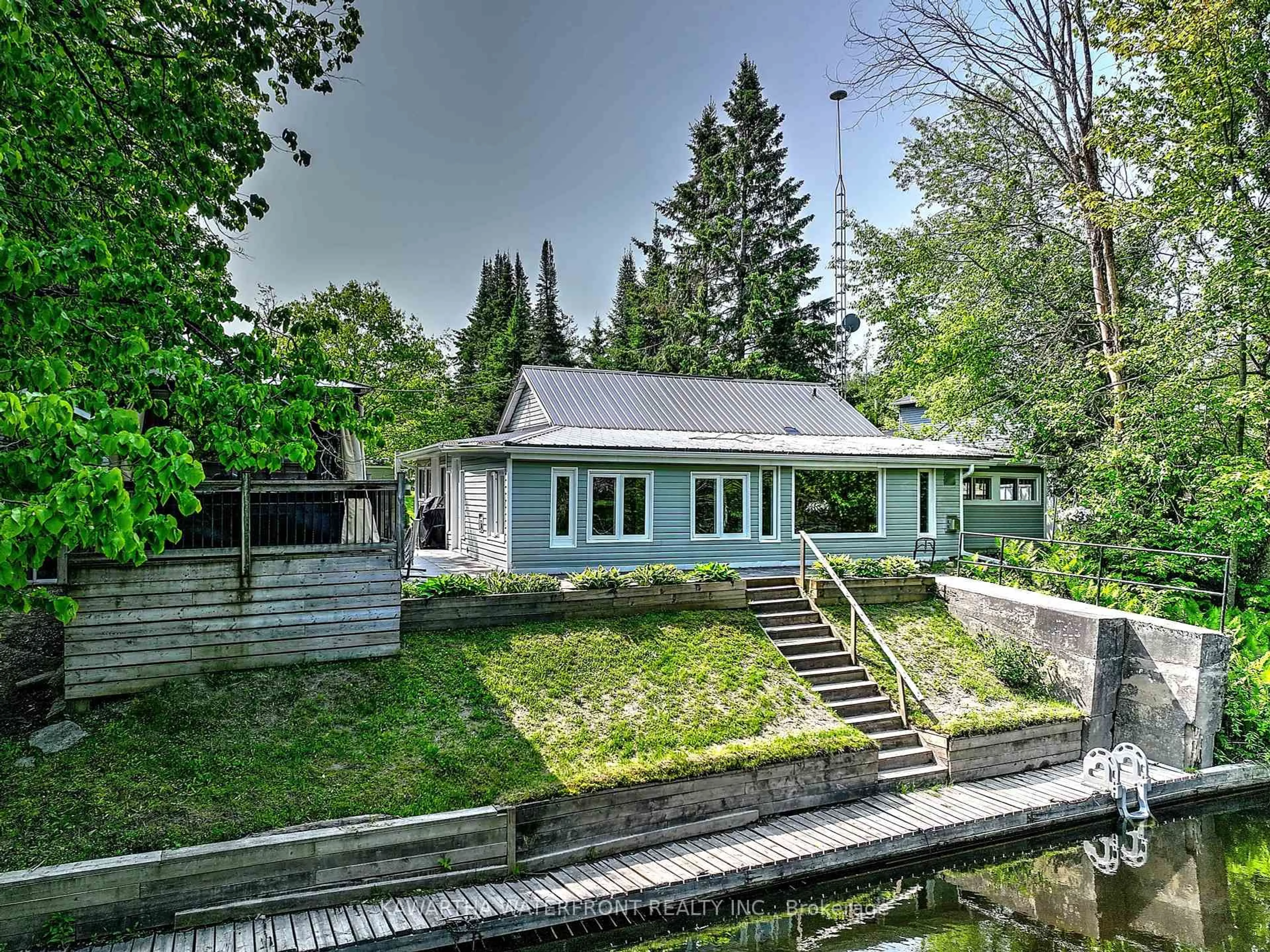 A pic from outside/outdoor area/front of a property/back of a property/a pic from drone, water/lake/river/ocean view for 82 Kozy Kove Rd, Kawartha Lakes Ontario K0M 1C0