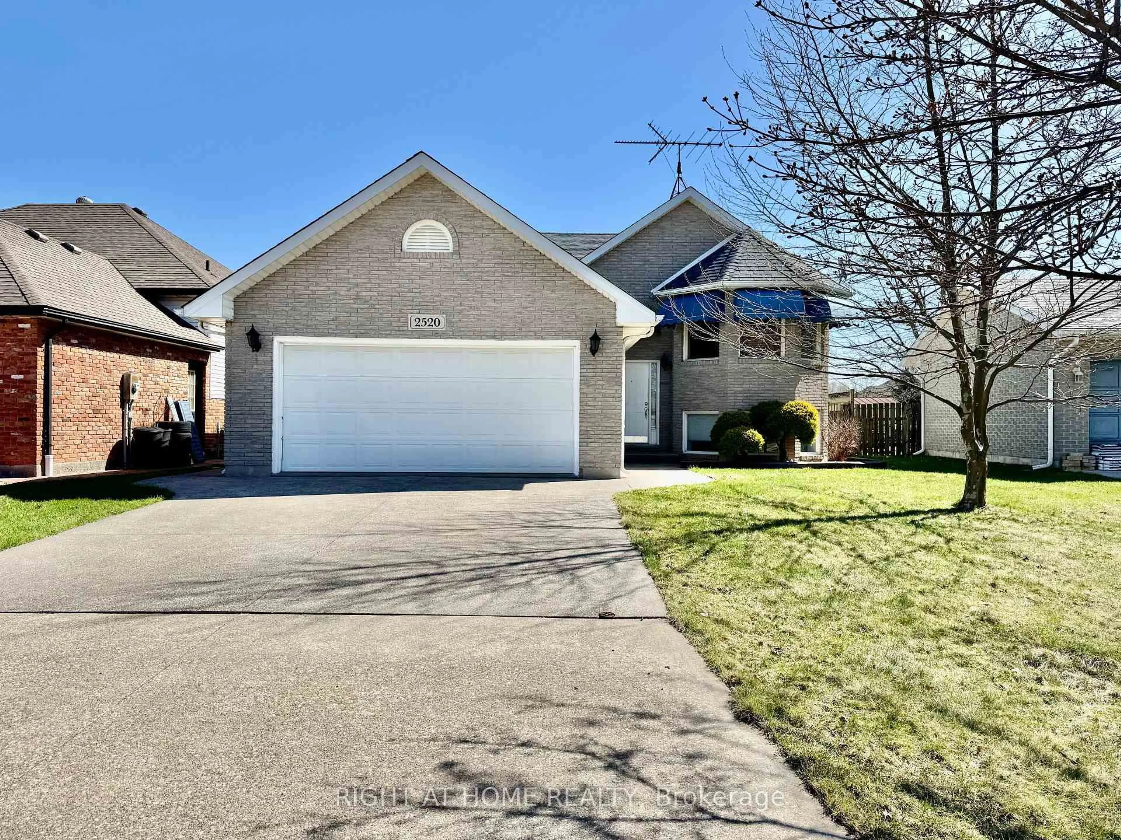 Home with vinyl exterior material, street for 2520 Strawberry Dr, Tecumseh Ontario N9K 1C3