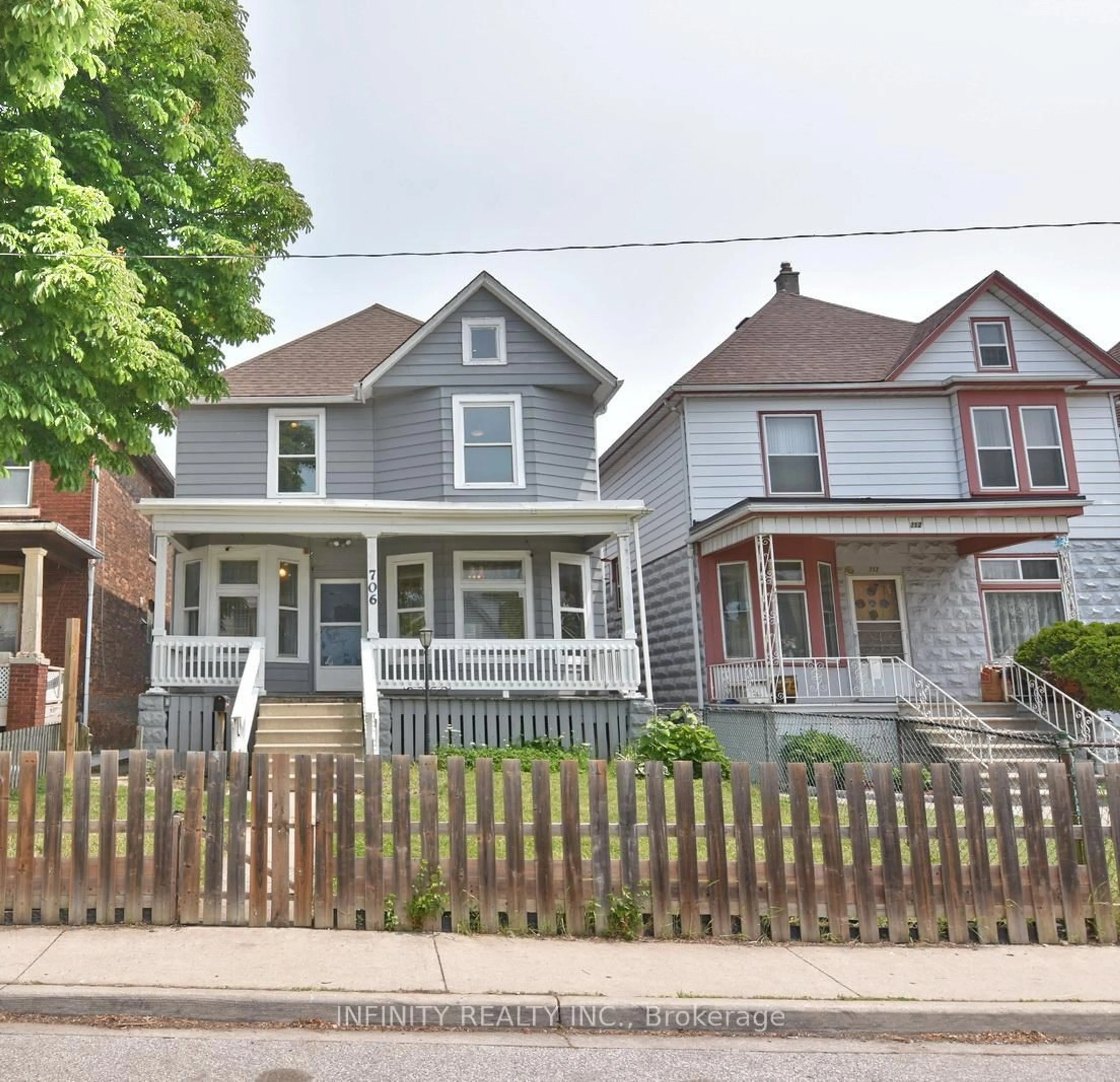 Home with vinyl exterior material, street for 706 Dougall Ave, Windsor Ontario N9A 4P8