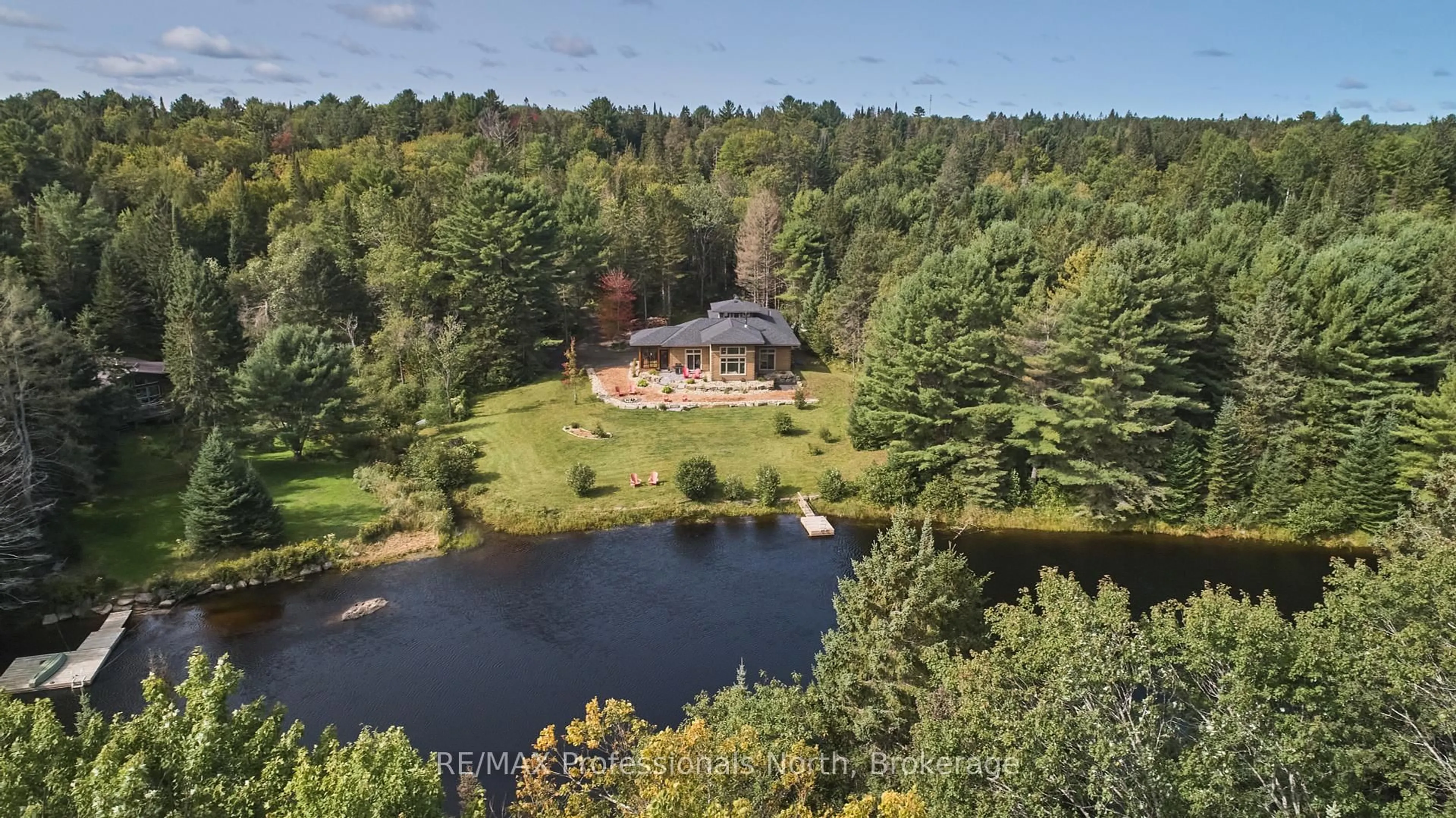 A pic from outside/outdoor area/front of a property/back of a property/a pic from drone, water/lake/river/ocean view for 203 Bonnell Rd, Bracebridge Ontario P1L 0M1