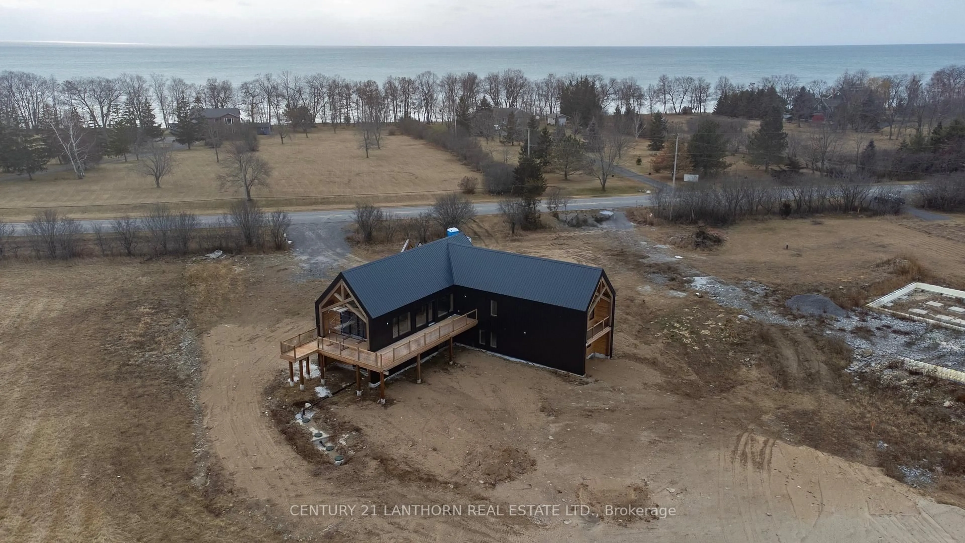 A pic from outside/outdoor area/front of a property/back of a property/a pic from drone, water/lake/river/ocean view for 1150 County Road 20 Rd, Prince Edward County Ontario K0K 2L0