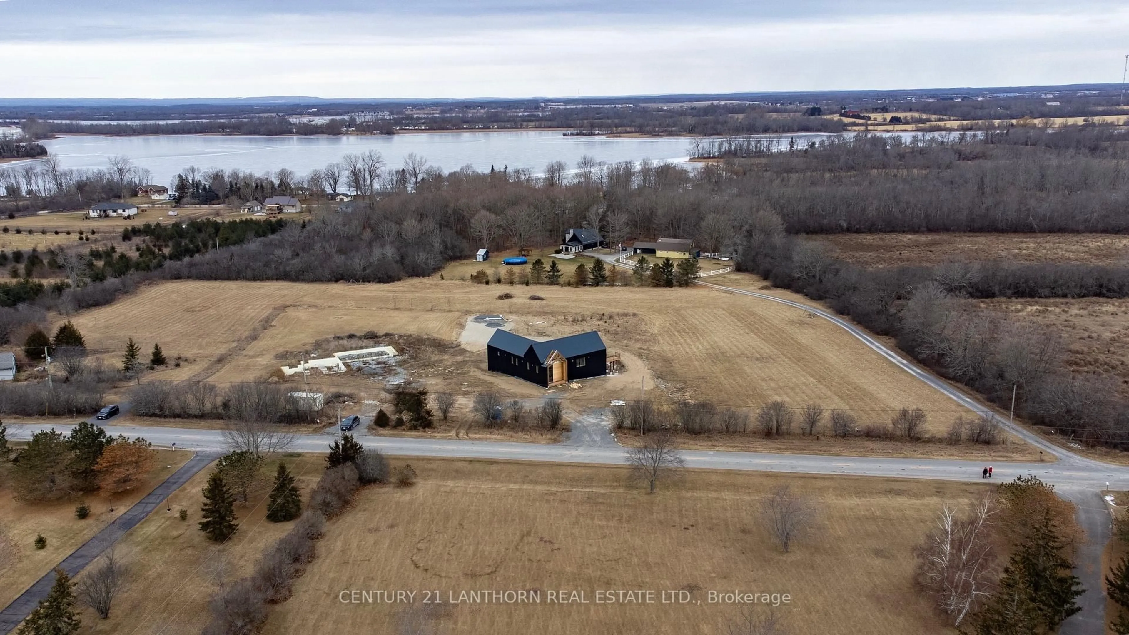 A pic from outside/outdoor area/front of a property/back of a property/a pic from drone, water/lake/river/ocean view for 1150 County Road 20 Rd, Prince Edward County Ontario K0K 2L0