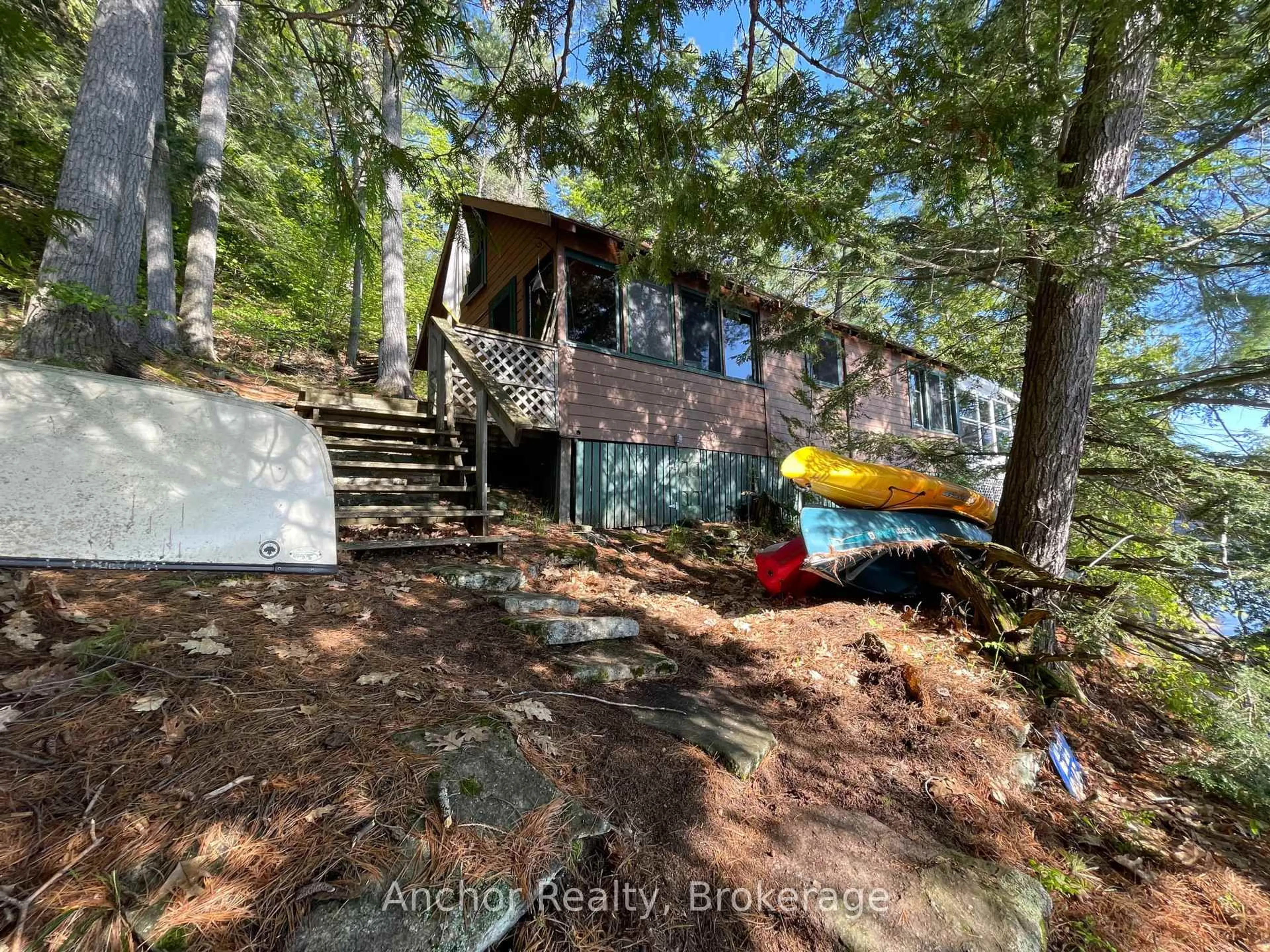 A pic from outside/outdoor area/front of a property/back of a property/a pic from drone, unknown for 10145 Little Hawk West Sho, Algonquin Highlands Ontario K0M 1S0