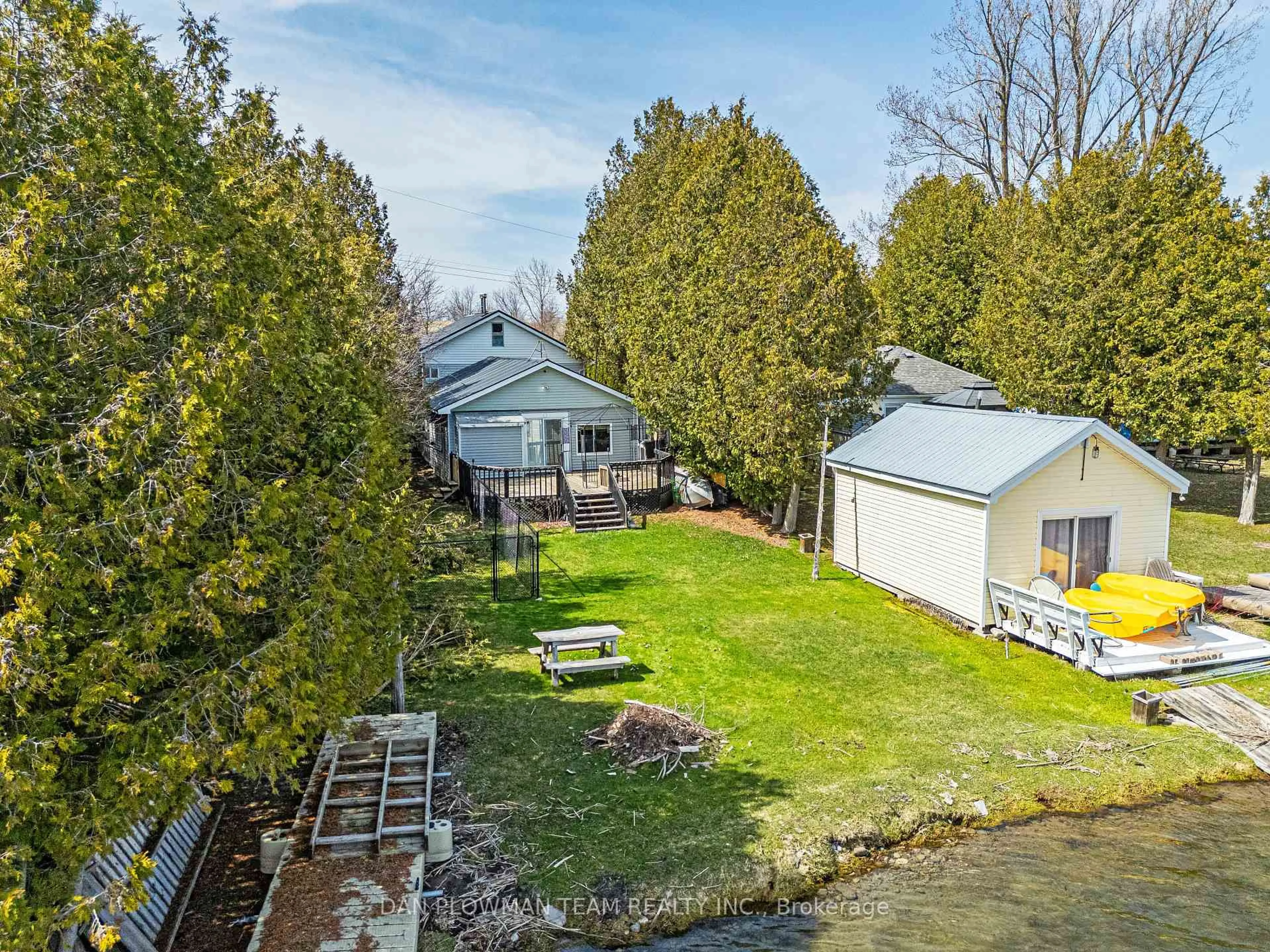 A pic from outside/outdoor area/front of a property/back of a property/a pic from drone, water/lake/river/ocean view for 32 Beach Rd, Kawartha Lakes Ontario K0M 2C0
