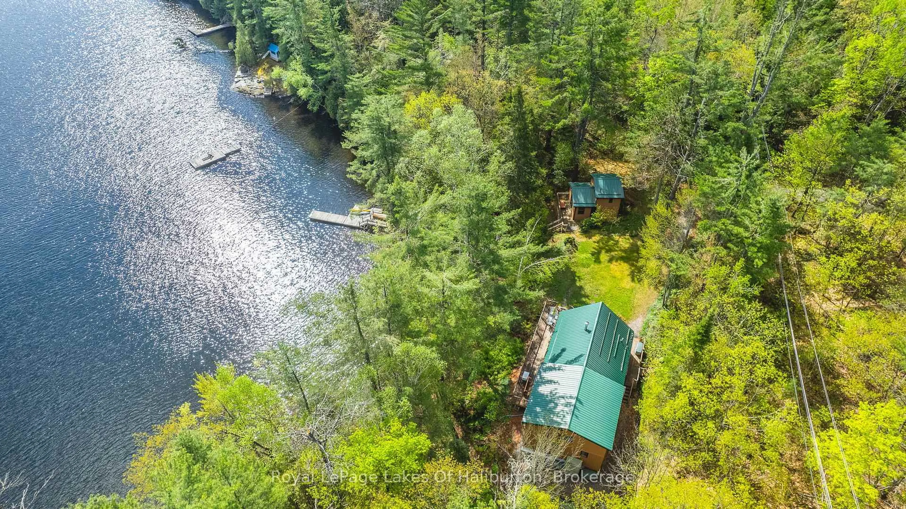A pic from outside/outdoor area/front of a property/back of a property/a pic from drone, water/lake/river/ocean view for 1029 Cam-Walt Tr, Minden Hills Ontario K0M 2K0