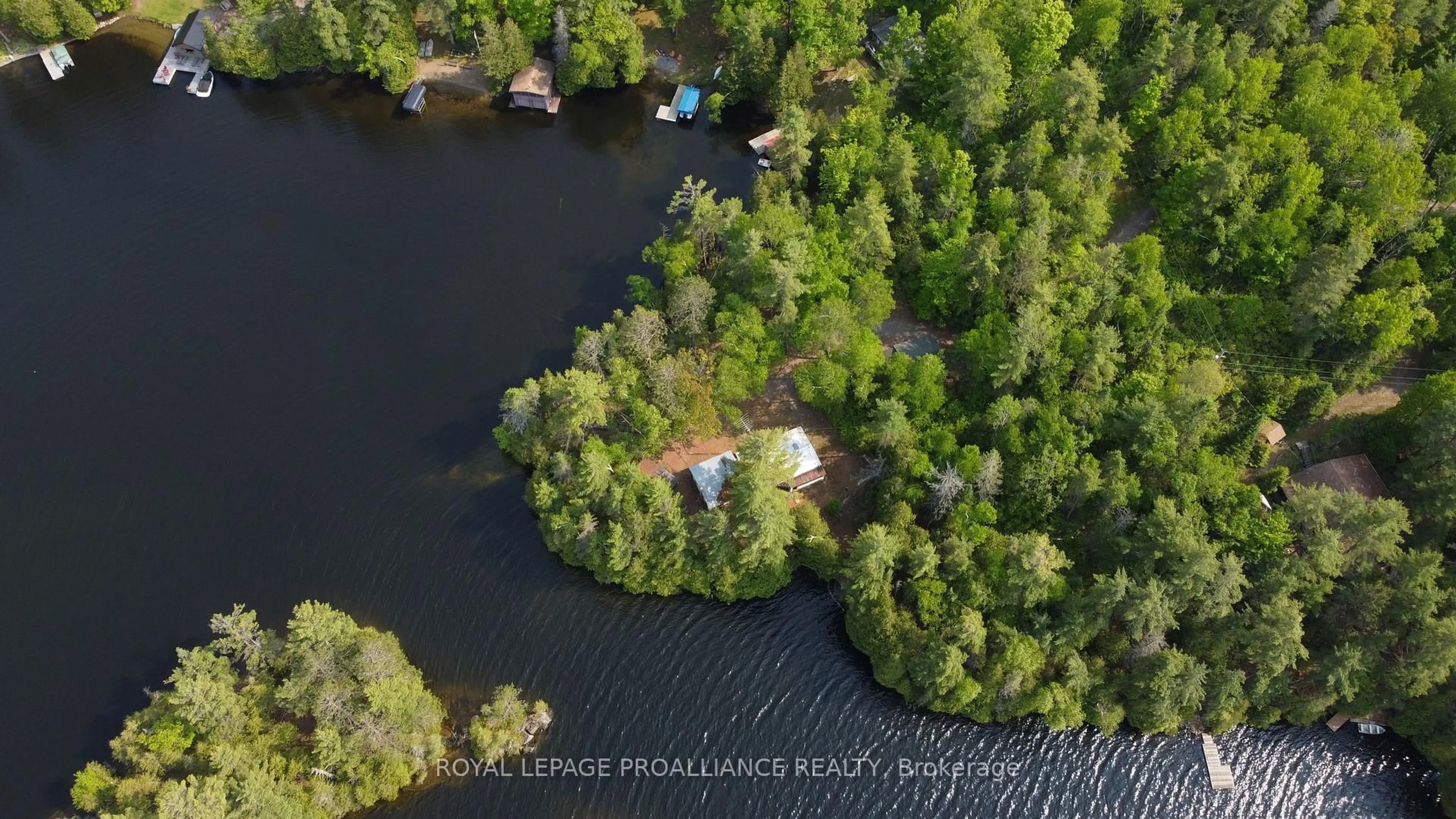 A pic from outside/outdoor area/front of a property/back of a property/a pic from drone, water/lake/river/ocean view for 1052 Ridgeway Lane, Arden Ontario K0H 1B0