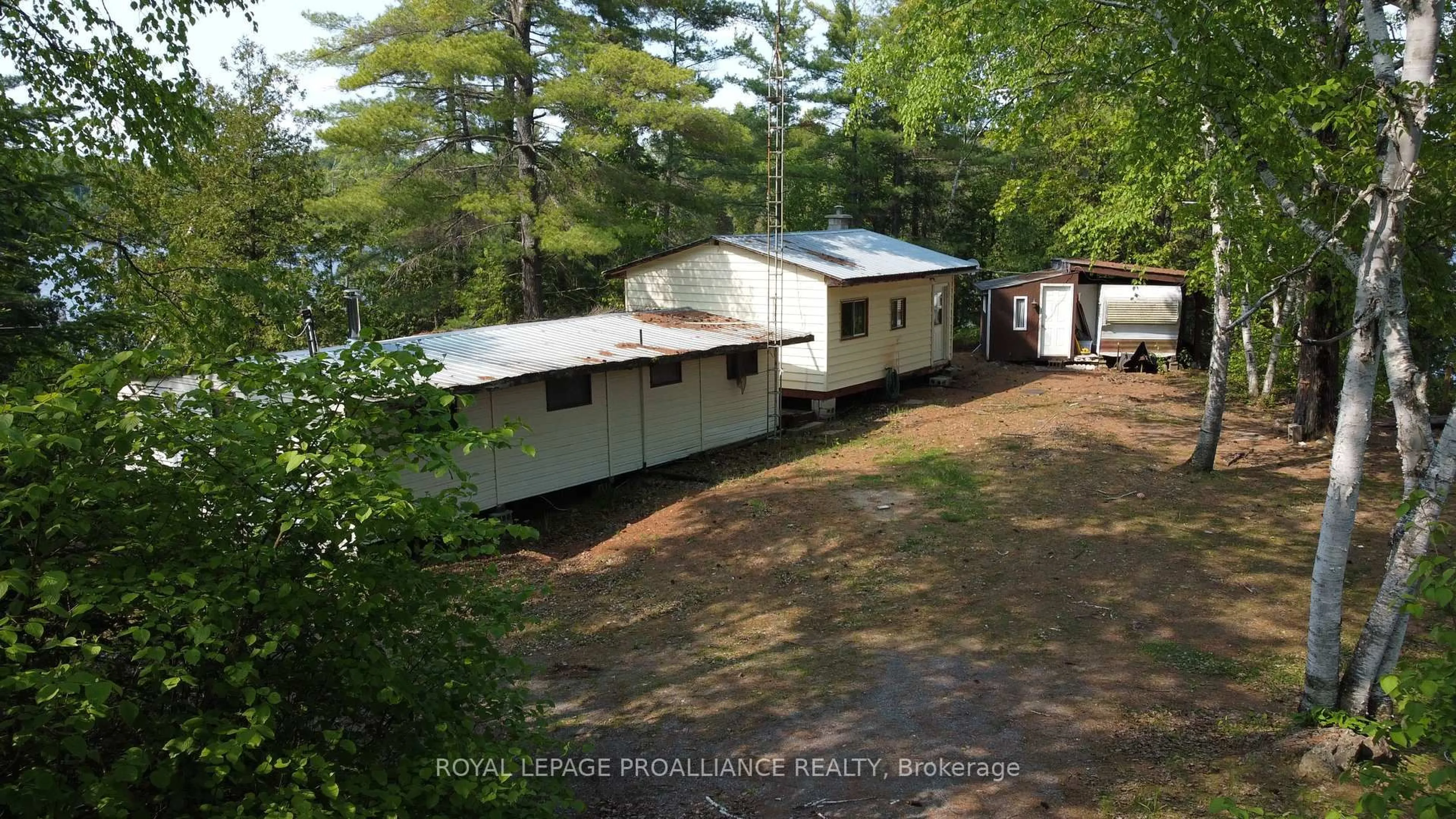 A pic from outside/outdoor area/front of a property/back of a property/a pic from drone, unknown for 1052 Ridgeway Lane, Arden Ontario K0H 1B0