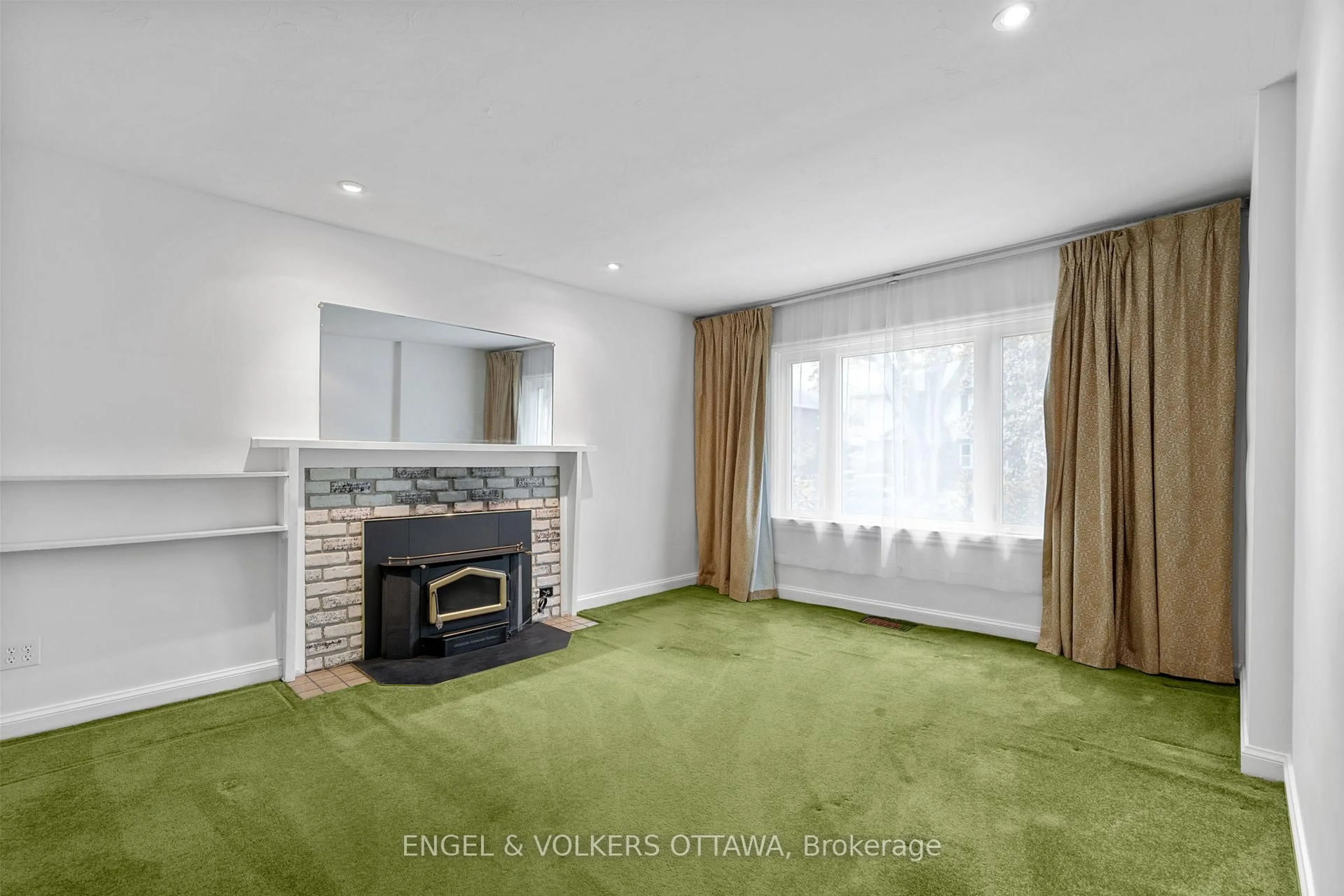 Living room with furniture, carpet floor for 38 Glencairn Ave, Ottawa Ontario K1S 1M6