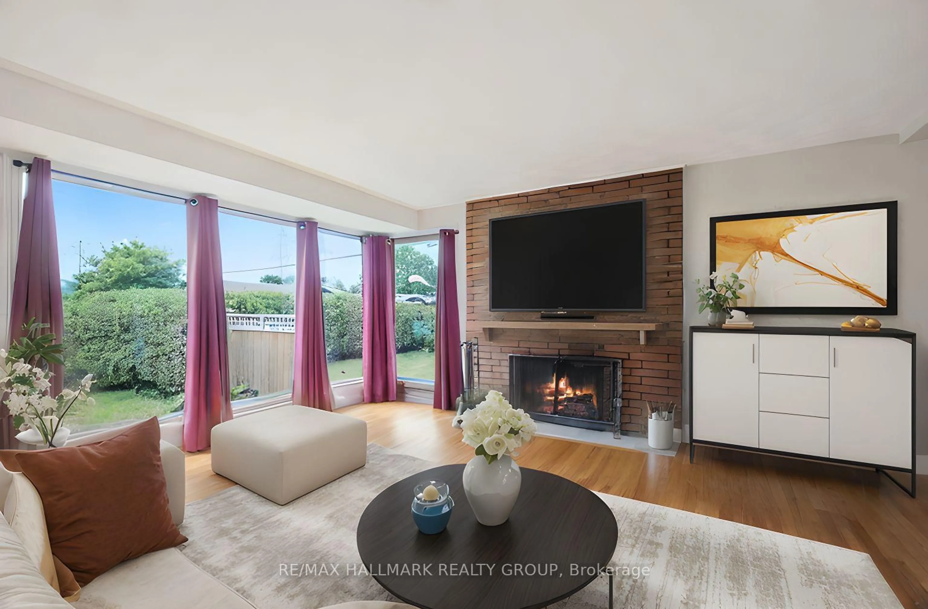 Living room with furniture, wood/laminate floor for 21 Gary Ave, Ottawa Ontario K2G 3L2