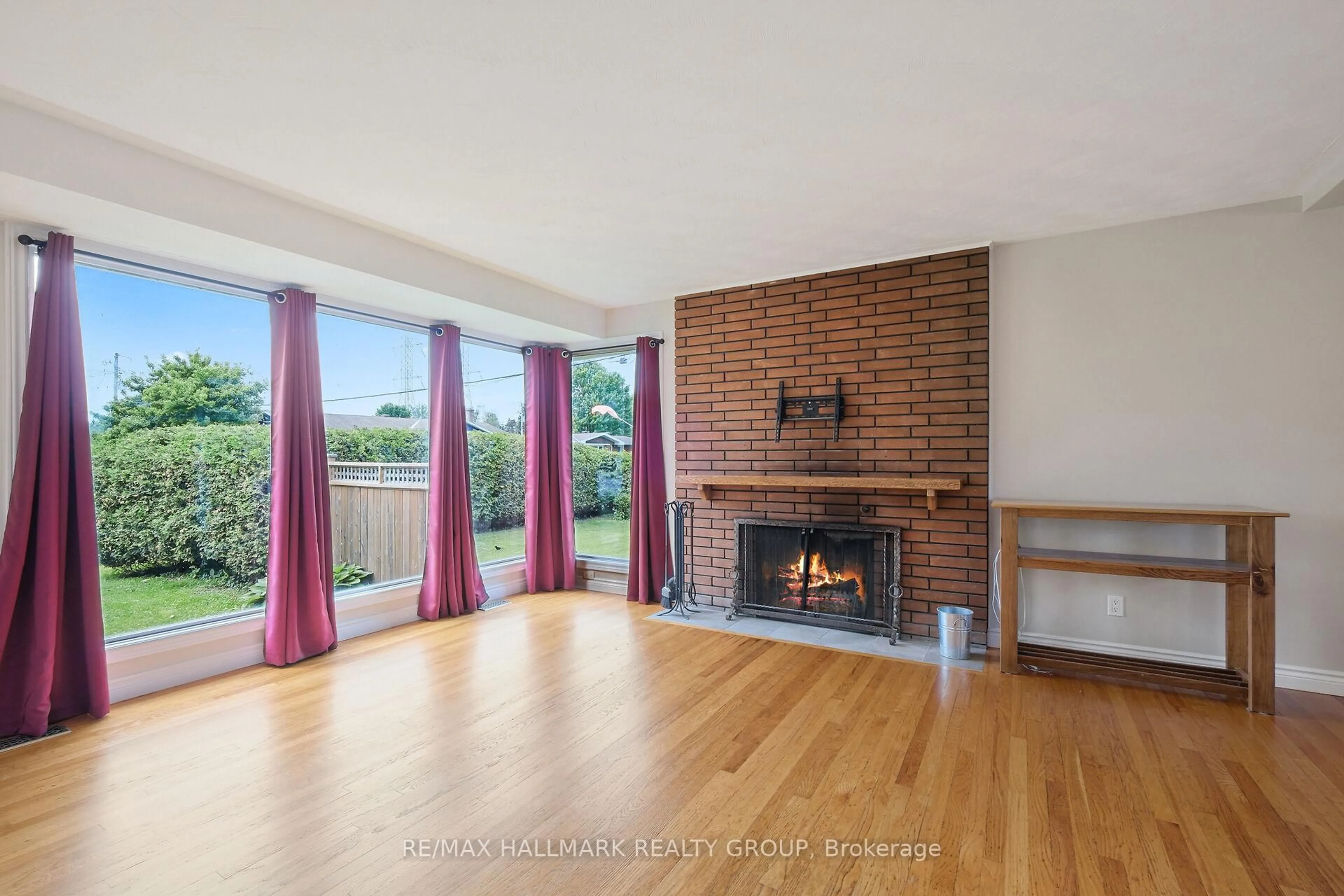 Living room with furniture, wood/laminate floor for 21 Gary Ave, Ottawa Ontario K2G 3L2