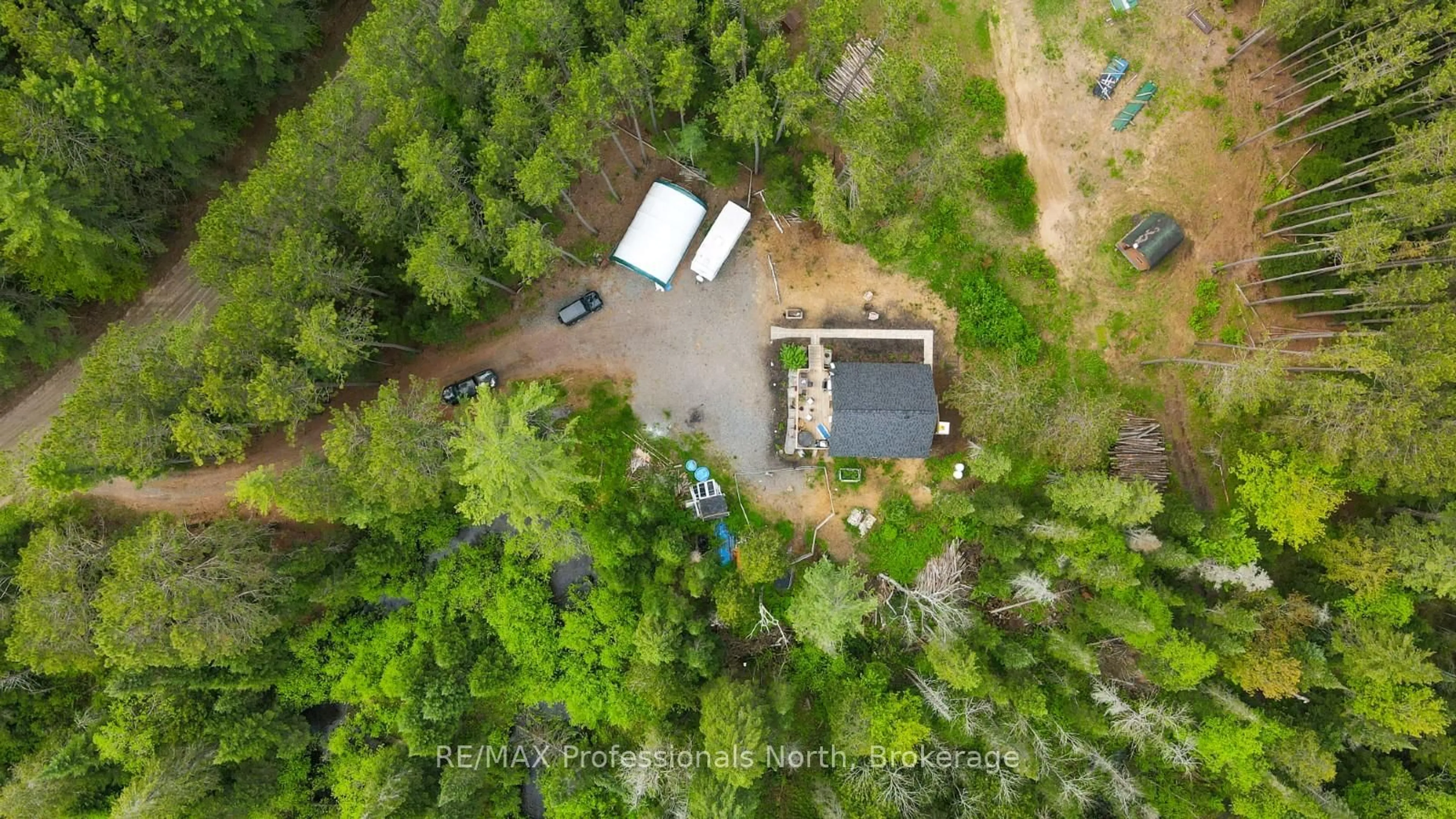 A pic from outside/outdoor area/front of a property/back of a property/a pic from drone, forest/trees view for 1392 Carroll Rd, Dysart et al Ontario K0M 1S0