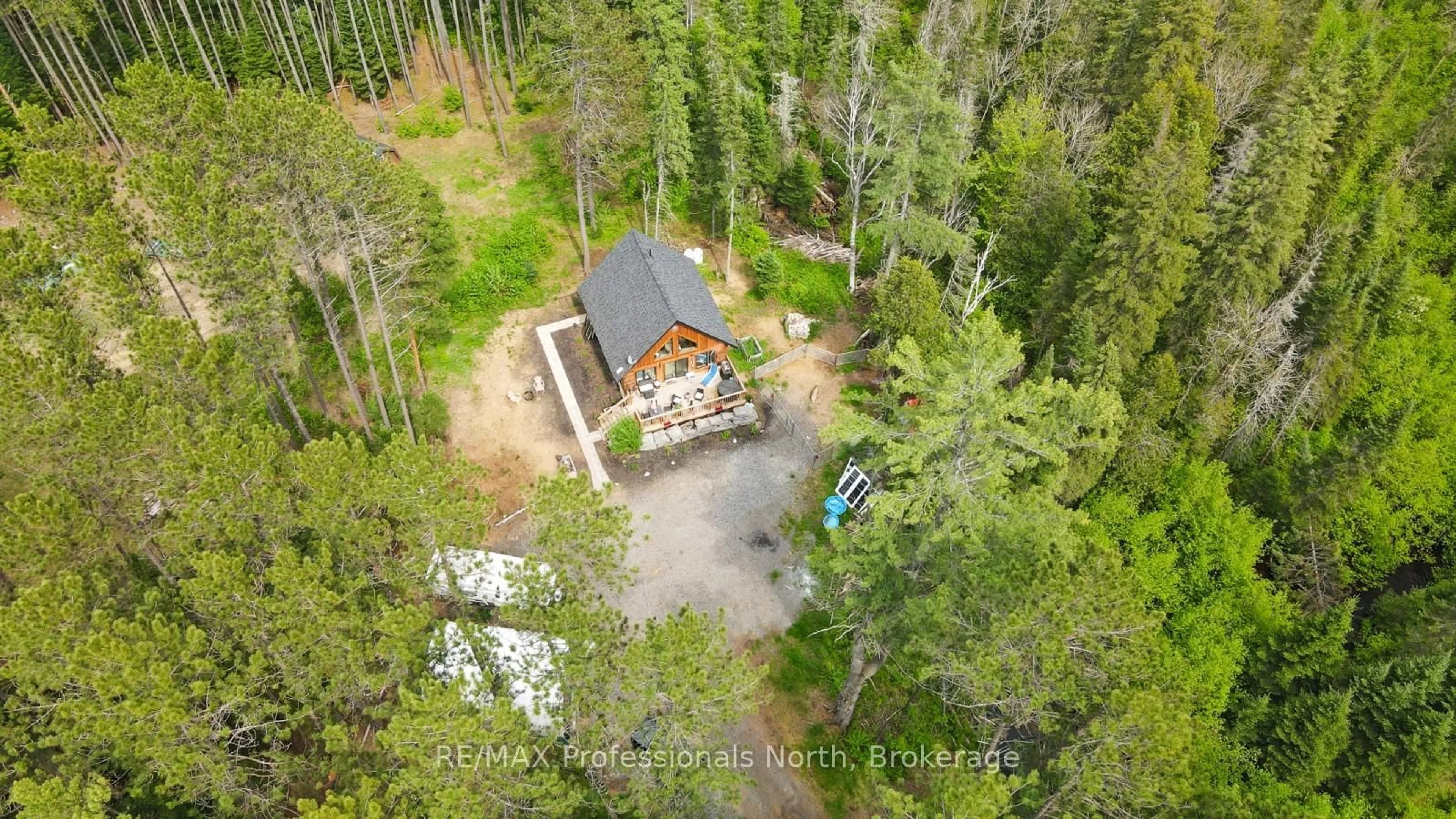 A pic from outside/outdoor area/front of a property/back of a property/a pic from drone, forest/trees view for 1392 Carroll Rd, Dysart et al Ontario K0M 1S0