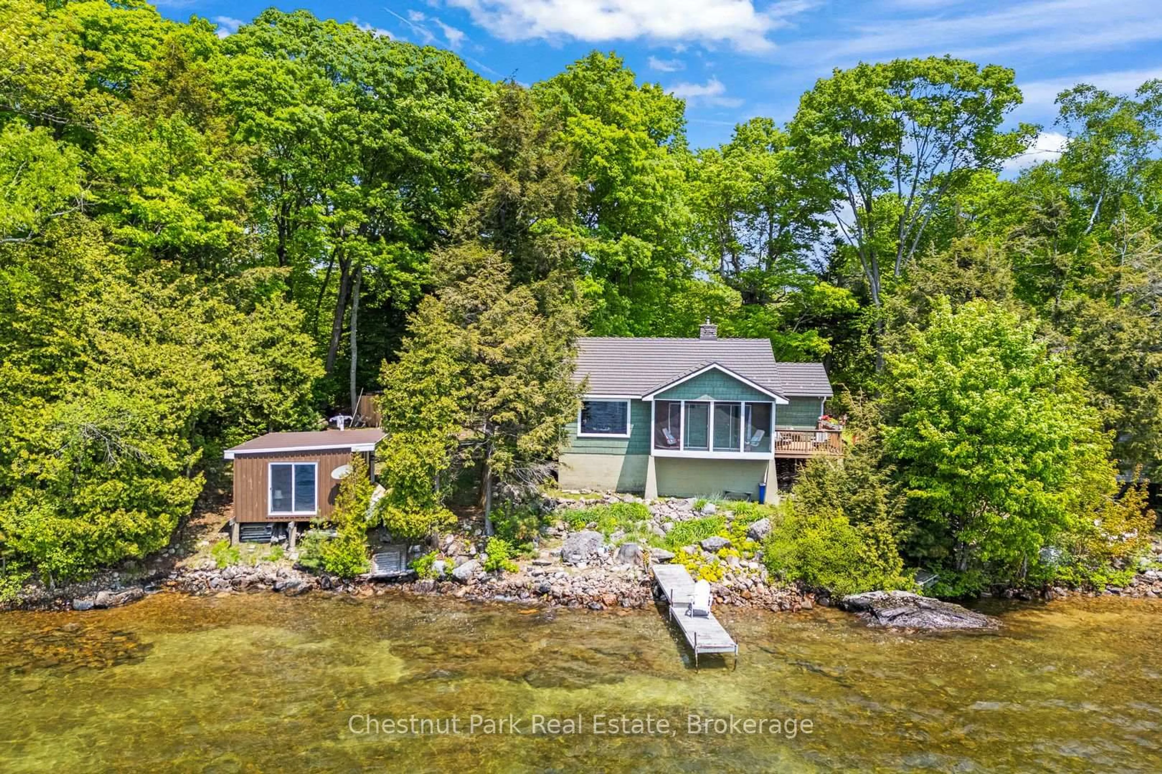A pic from outside/outdoor area/front of a property/back of a property/a pic from drone, water/lake/river/ocean view for 199 Long Point Rd, Huntsville Ontario P0B 1M0