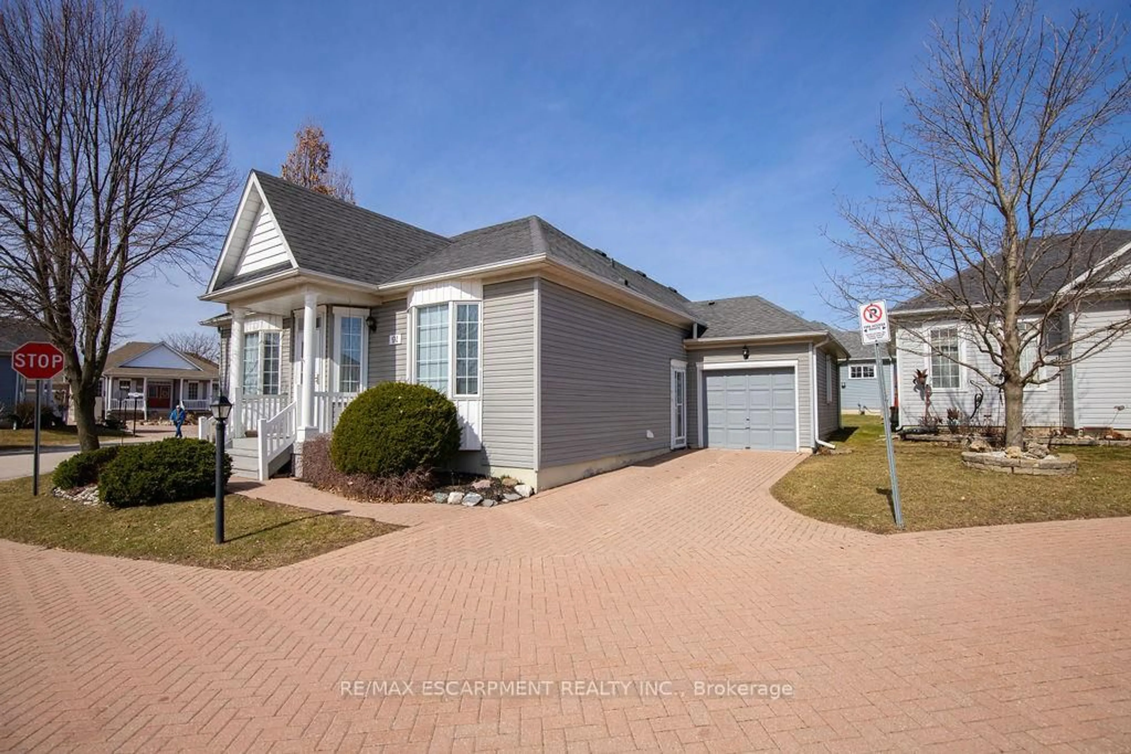 Home with vinyl exterior material, street for 91 Silverbirch Blvd #13, Hamilton Ontario L0R 1W0