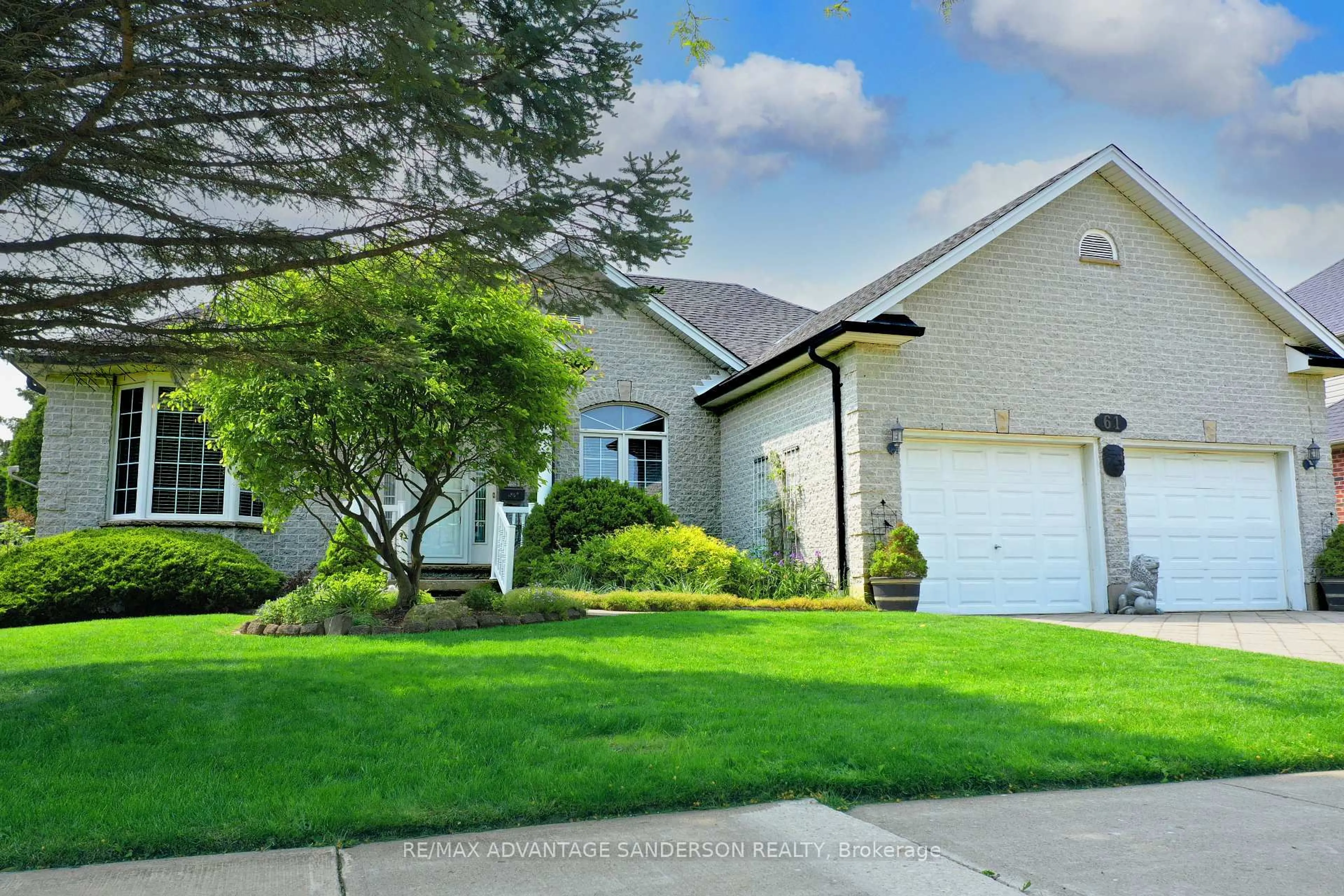 Home with vinyl exterior material, street for 61 Calvert Lane, Middlesex Centre Ontario N0M 2A0