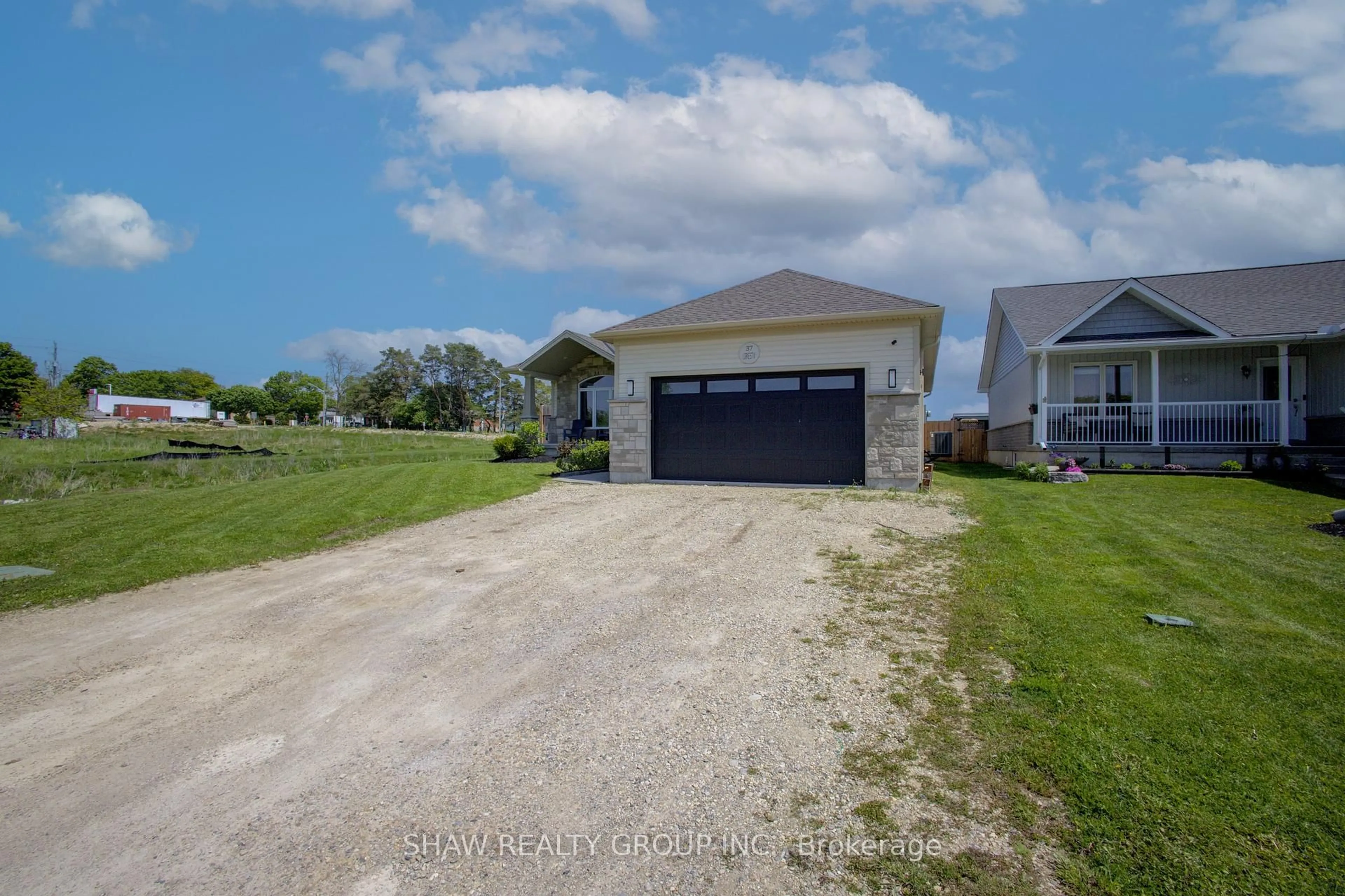 A pic from outside/outdoor area/front of a property/back of a property/a pic from drone, water/lake/river/ocean view for 37 Lorne St, Minto Ontario N0G 1Z0