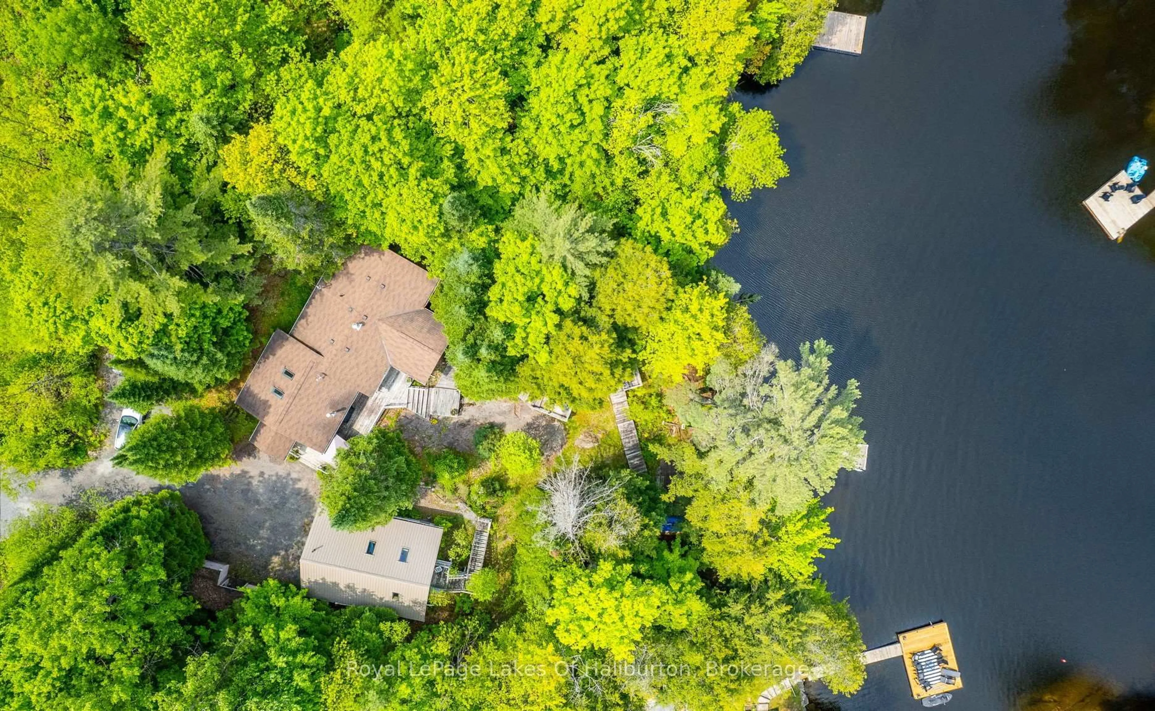 A pic from outside/outdoor area/front of a property/back of a property/a pic from drone, water/lake/river/ocean view for 1700 Kushog Lake Rd, Algonquin Highlands Ontario K0M 1S0