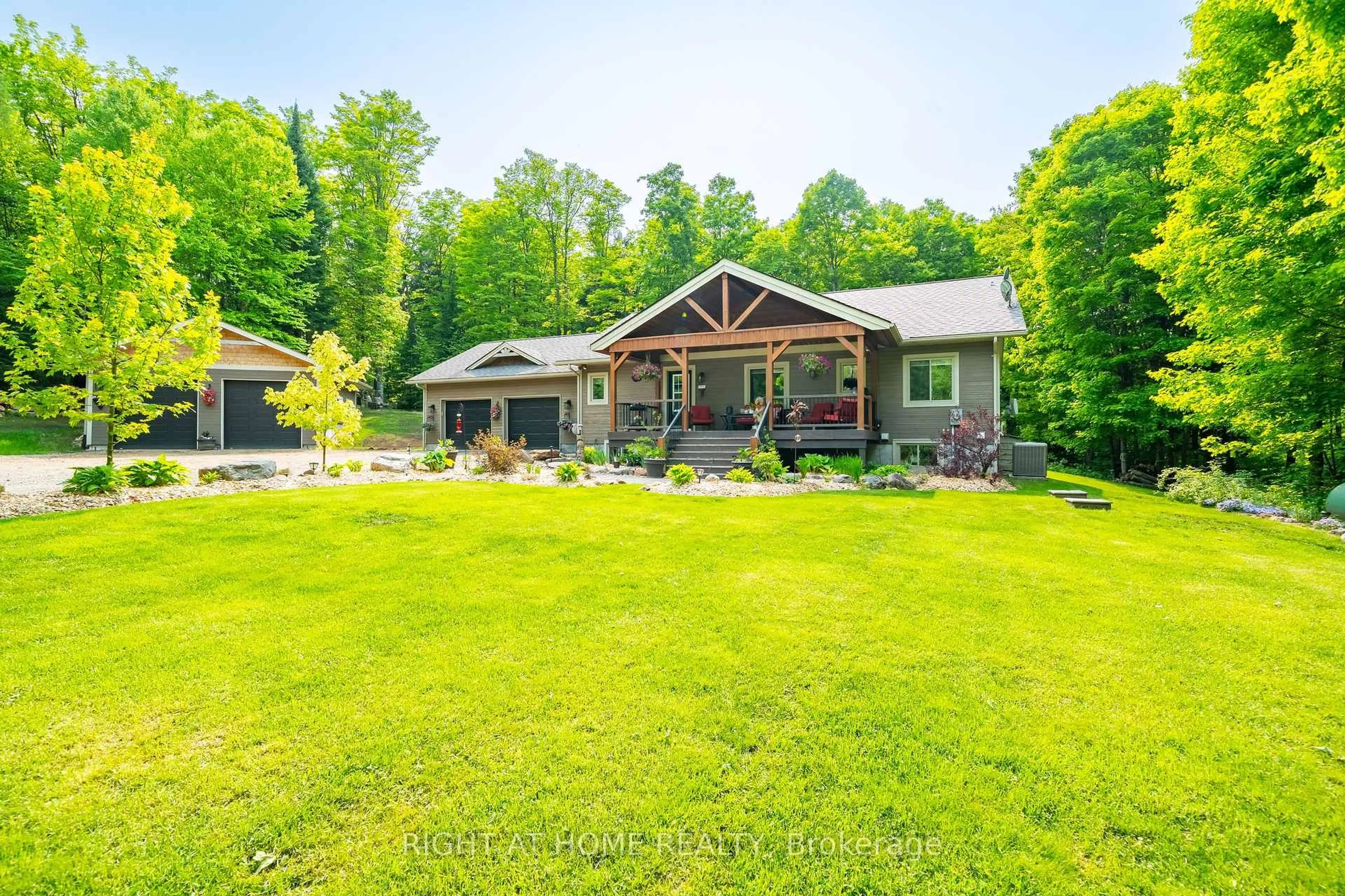A pic from outside/outdoor area/front of a property/back of a property/a pic from drone, unknown for 12028 Highway 118 Highway, Dysart et al Ontario K0M 1S0