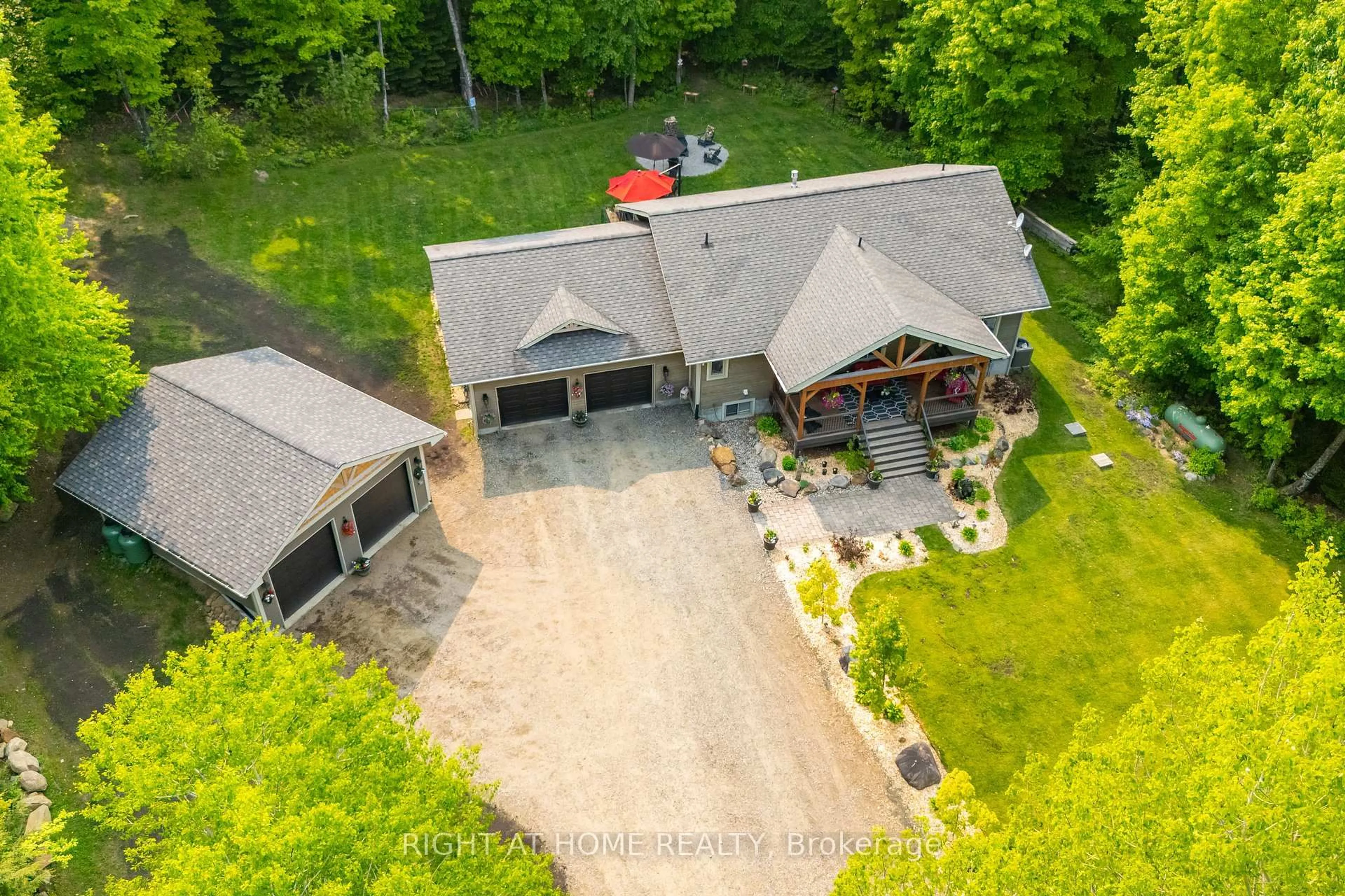 A pic from outside/outdoor area/front of a property/back of a property/a pic from drone, unknown for 12028 Highway 118 Highway, Dysart et al Ontario K0M 1S0