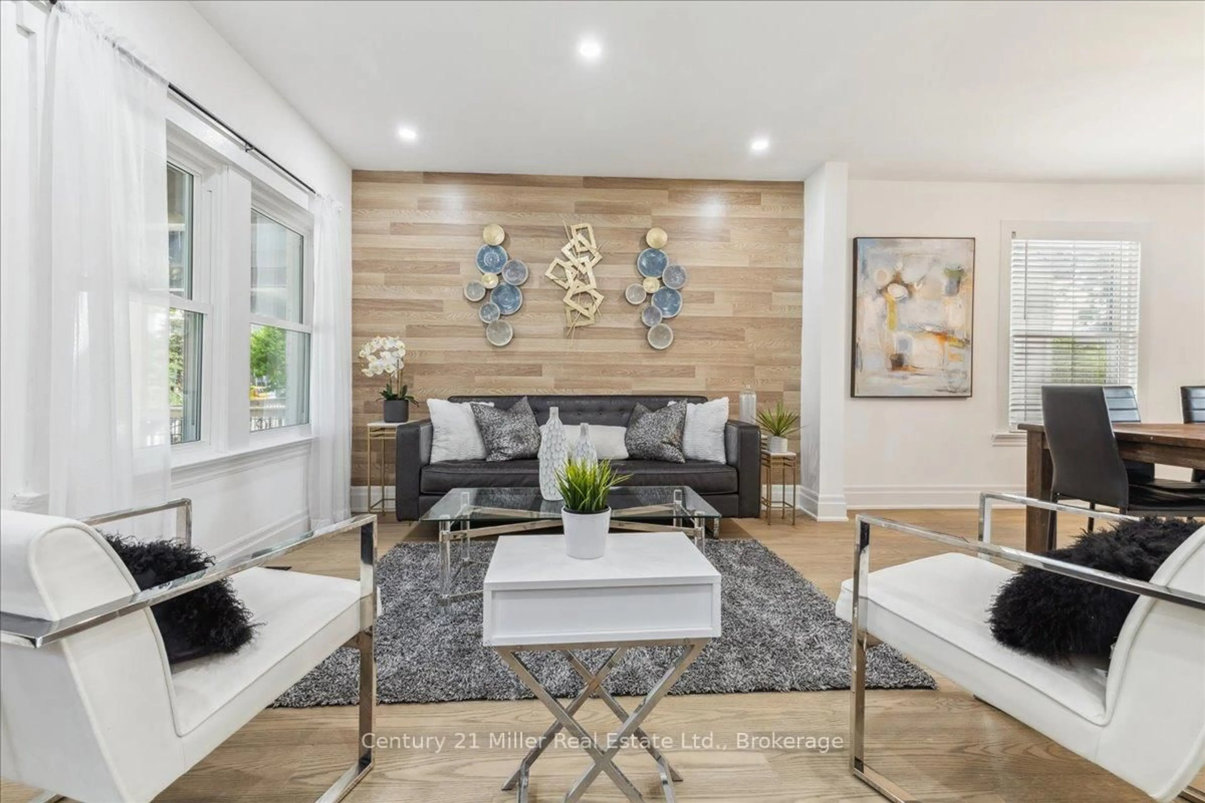 Living room with furniture, wood/laminate floor for 237 Balmoral Ave, Hamilton Ontario L8L 7S1