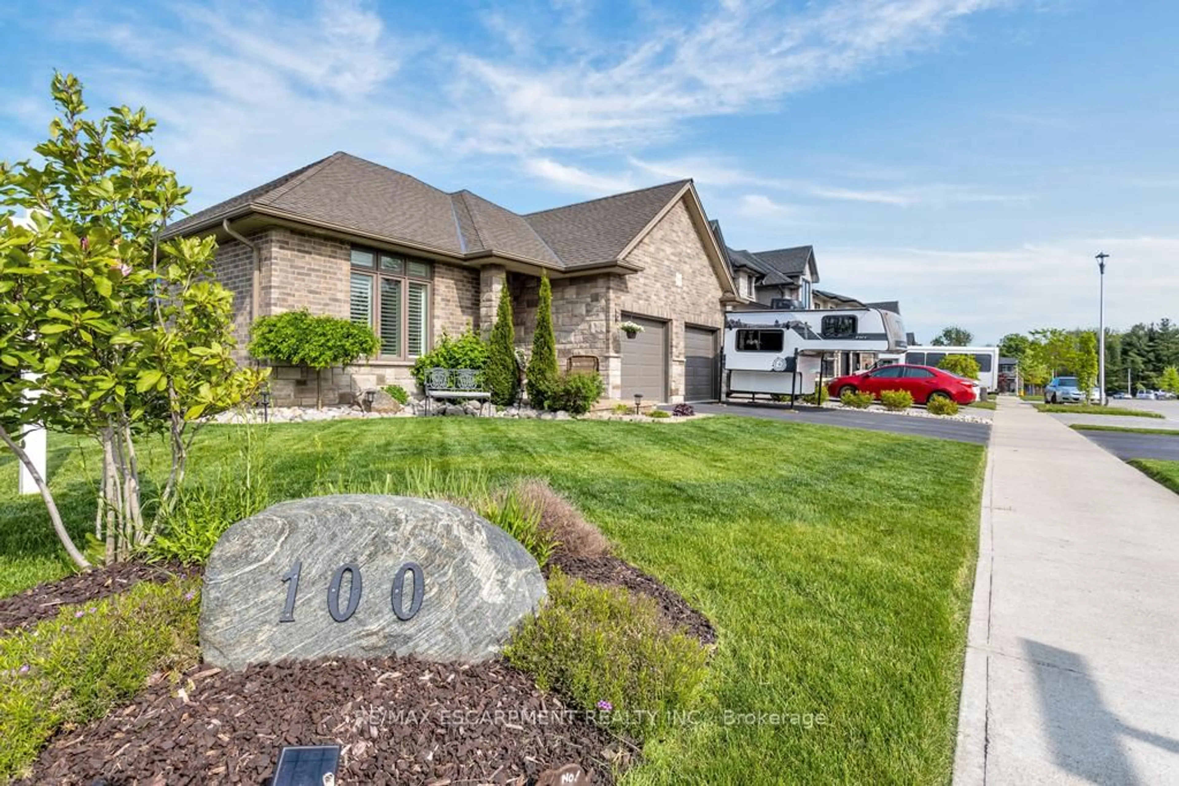 Home with brick exterior material, street for 100 Tamarack Blvd, Woodstock Ontario N4S 0E2
