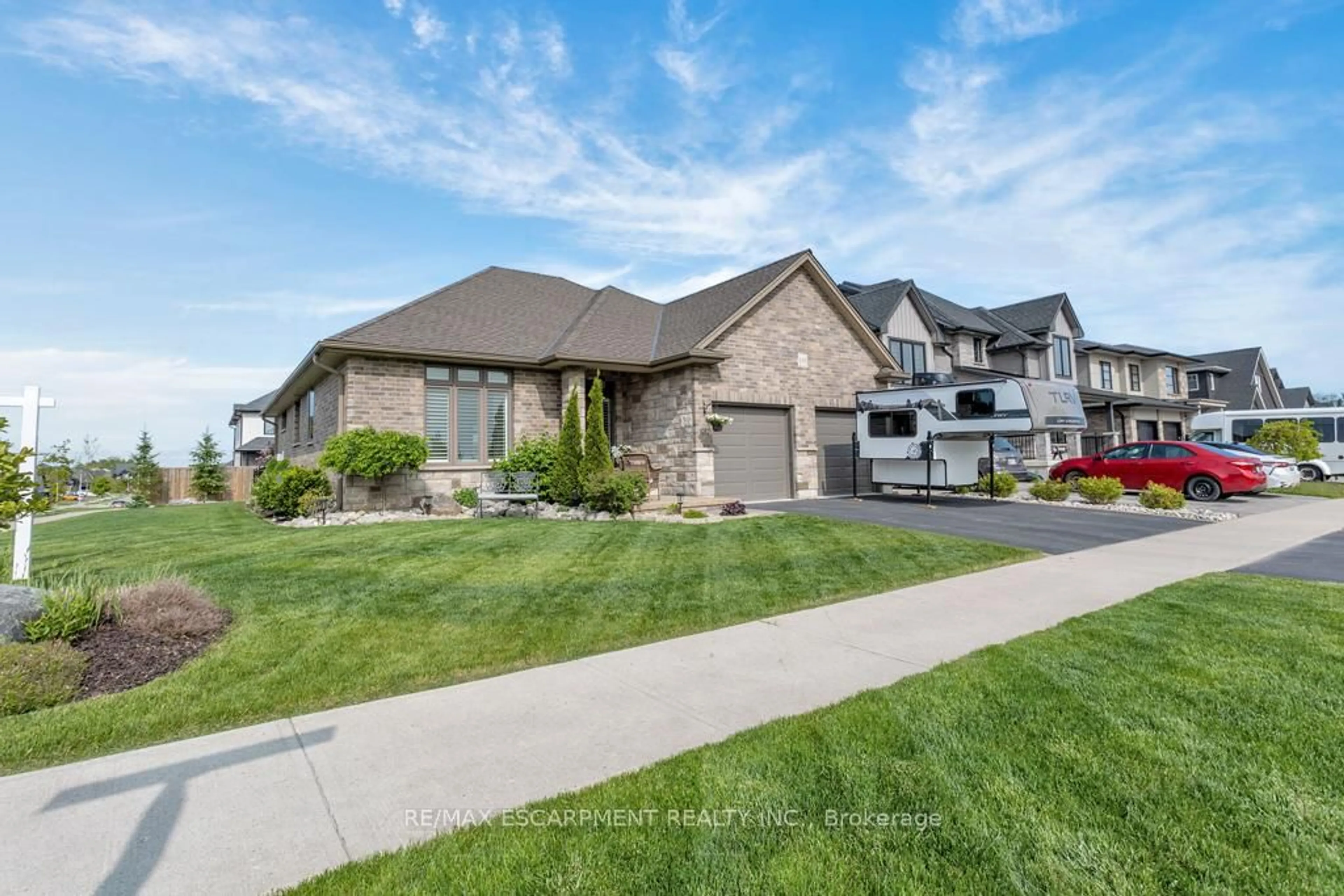 Home with brick exterior material, street for 100 Tamarack Blvd, Woodstock Ontario N4S 0E2
