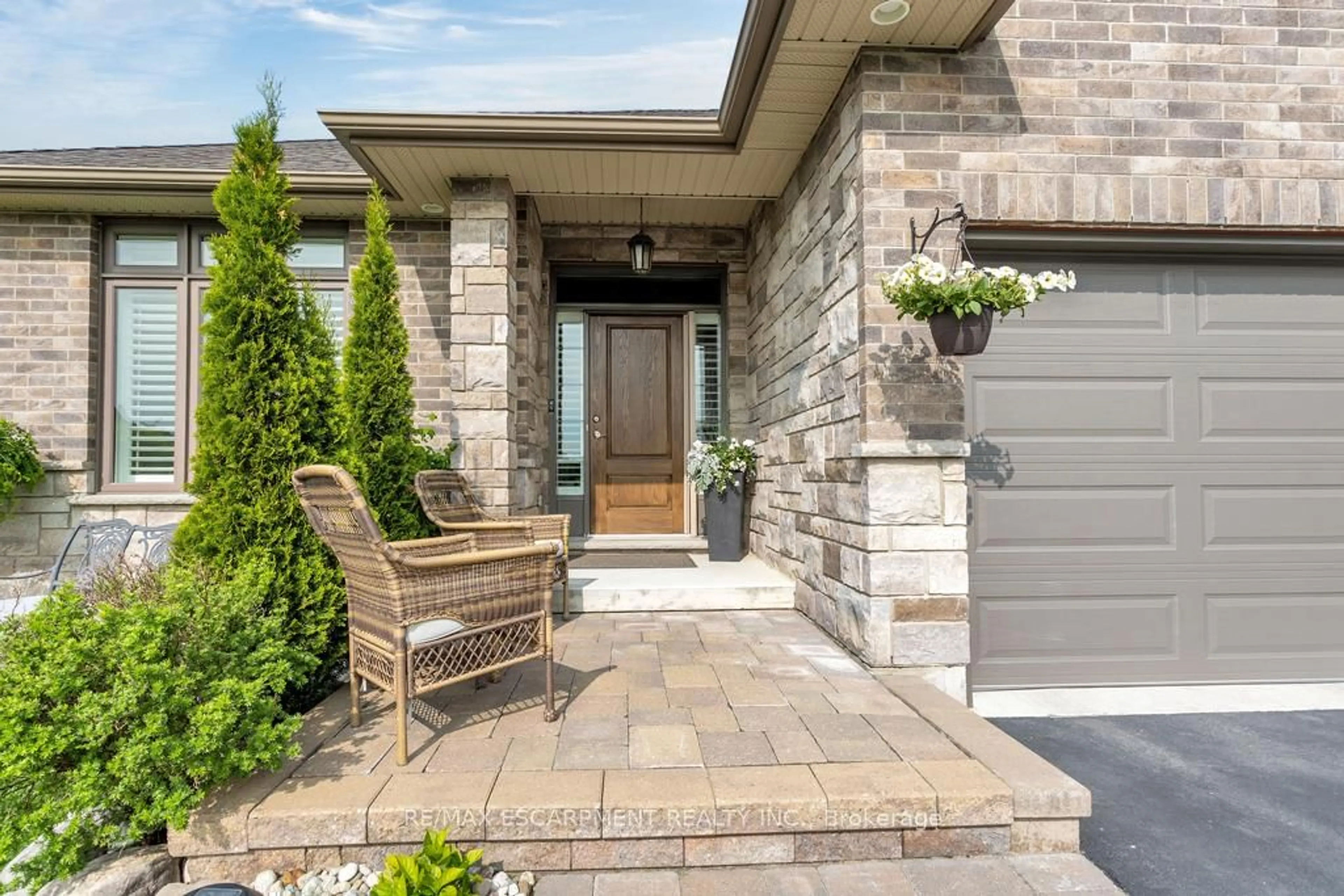 Home with brick exterior material, street for 100 Tamarack Blvd, Woodstock Ontario N4S 0E2