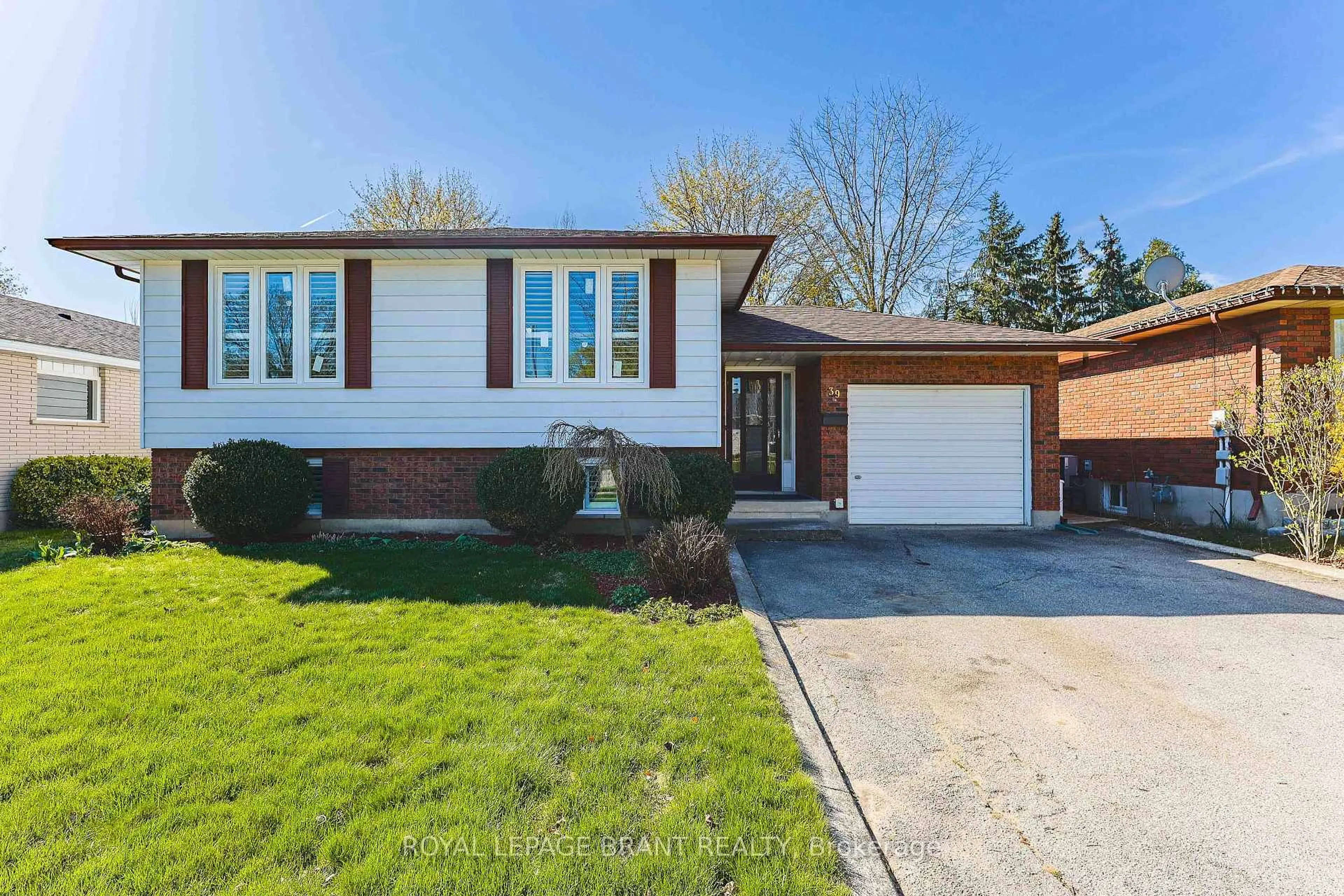 Home with brick exterior material, street for 39 Wildflower Lane, Brantford Ontario N3R 6B3