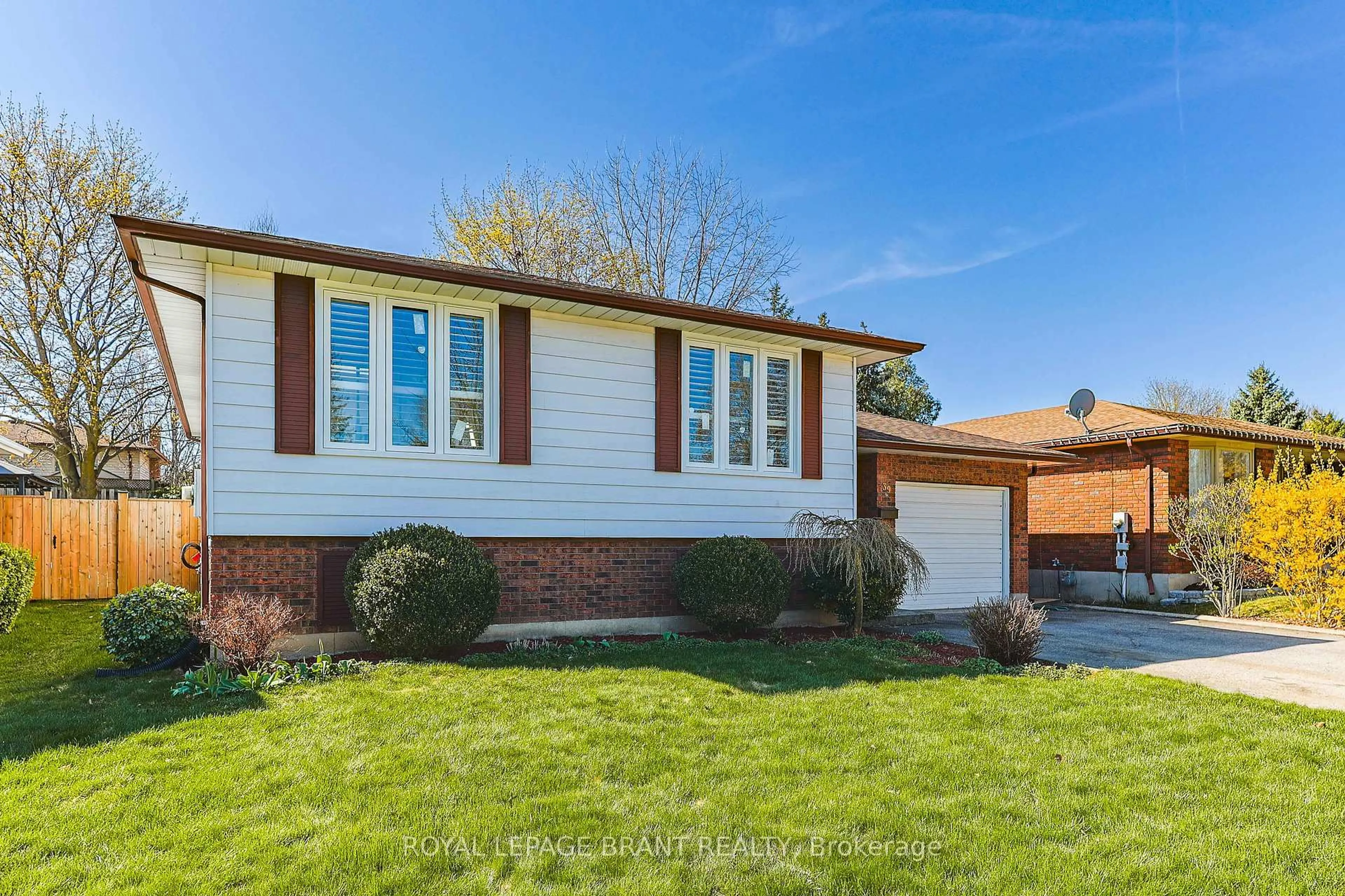 Home with brick exterior material, street for 39 Wildflower Lane, Brantford Ontario N3R 6B3