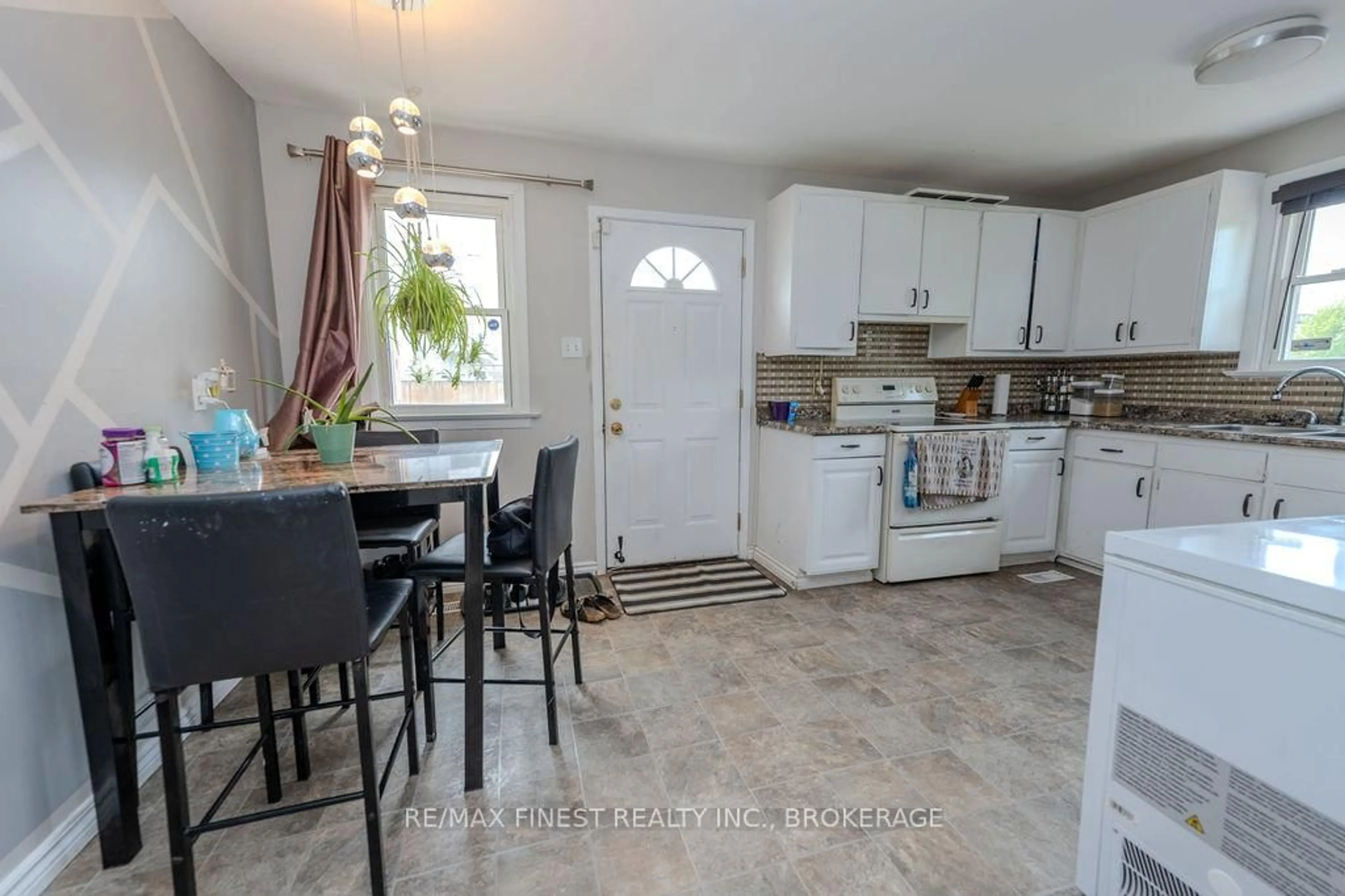 Open concept kitchen, ceramic/tile floor for 559 MacDonnell St, Kingston Ontario K7K 4W9