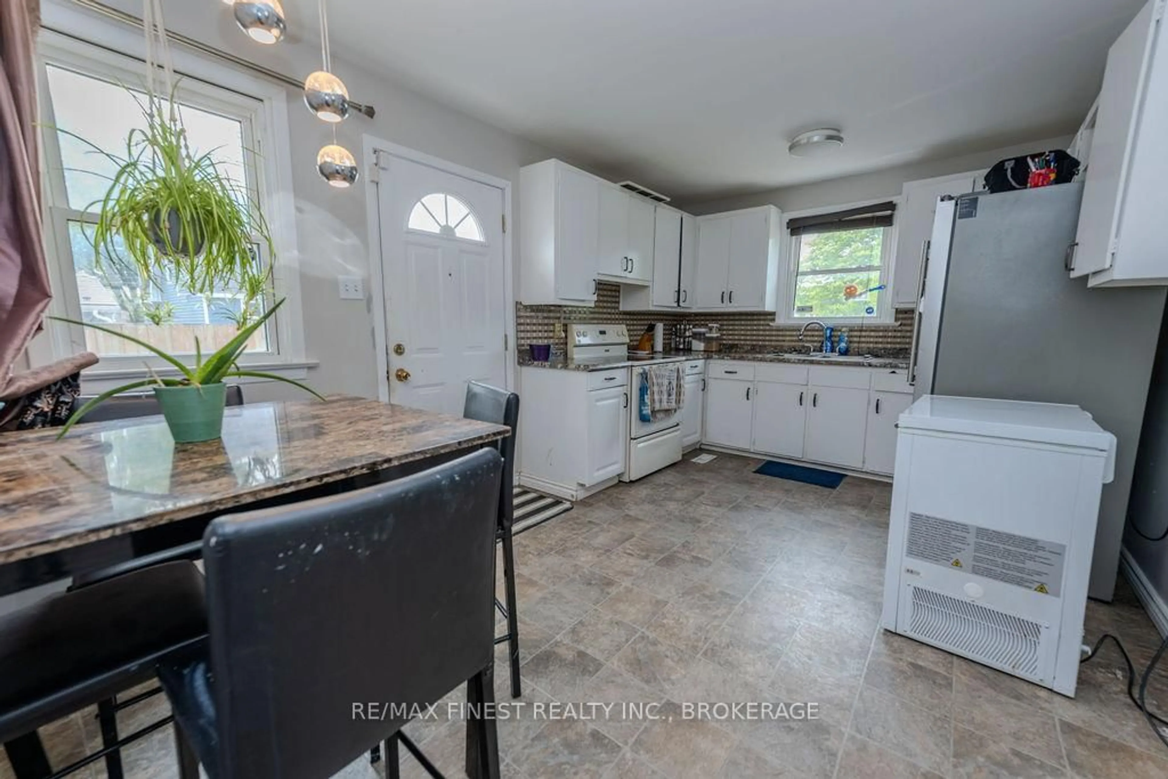 Open concept kitchen, ceramic/tile floor for 559 MacDonnell St, Kingston Ontario K7K 4W9