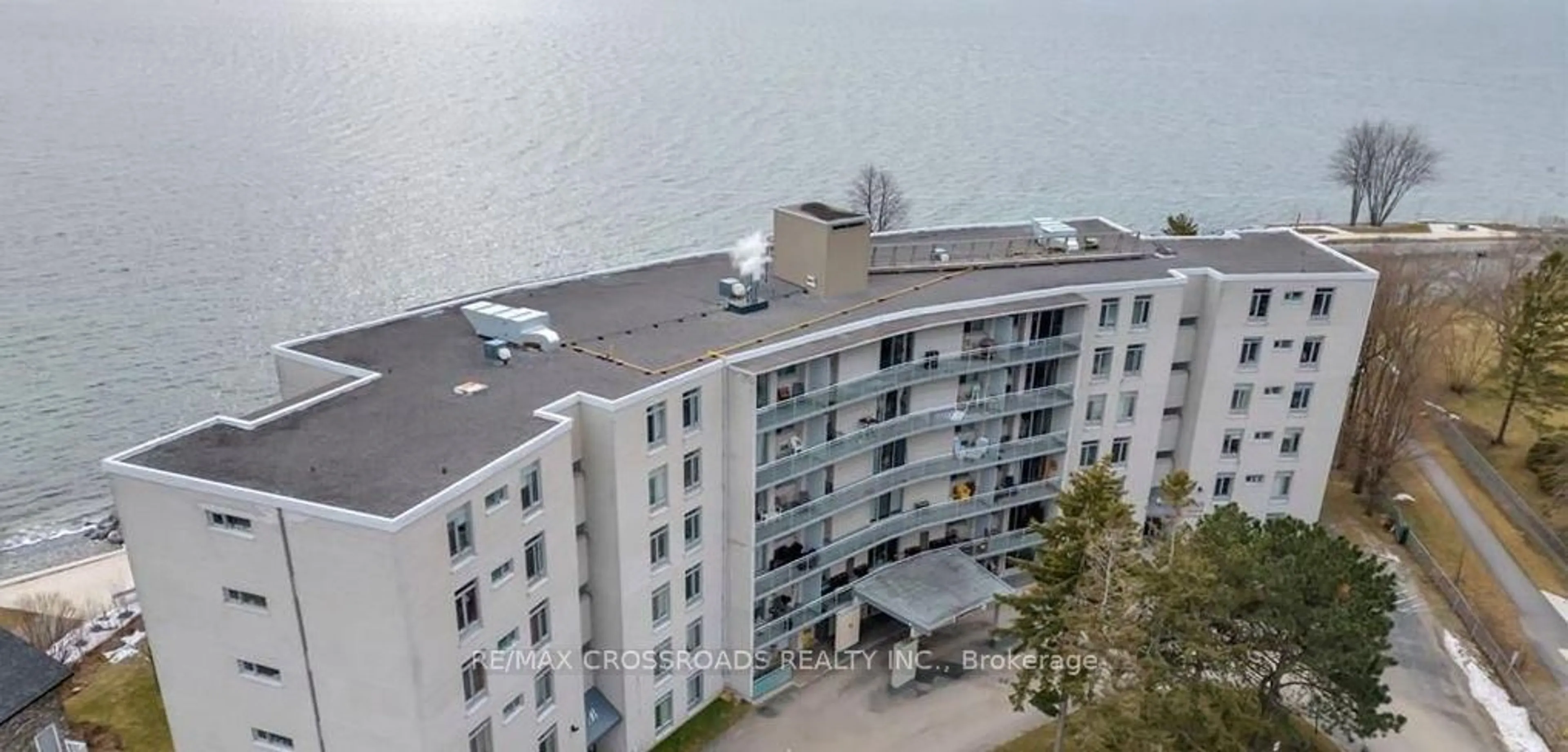 A pic from outside/outdoor area/front of a property/back of a property/a pic from drone, water/lake/river/ocean view for 1 Mowat Ave #209, Kingston Ontario K7M 1J8