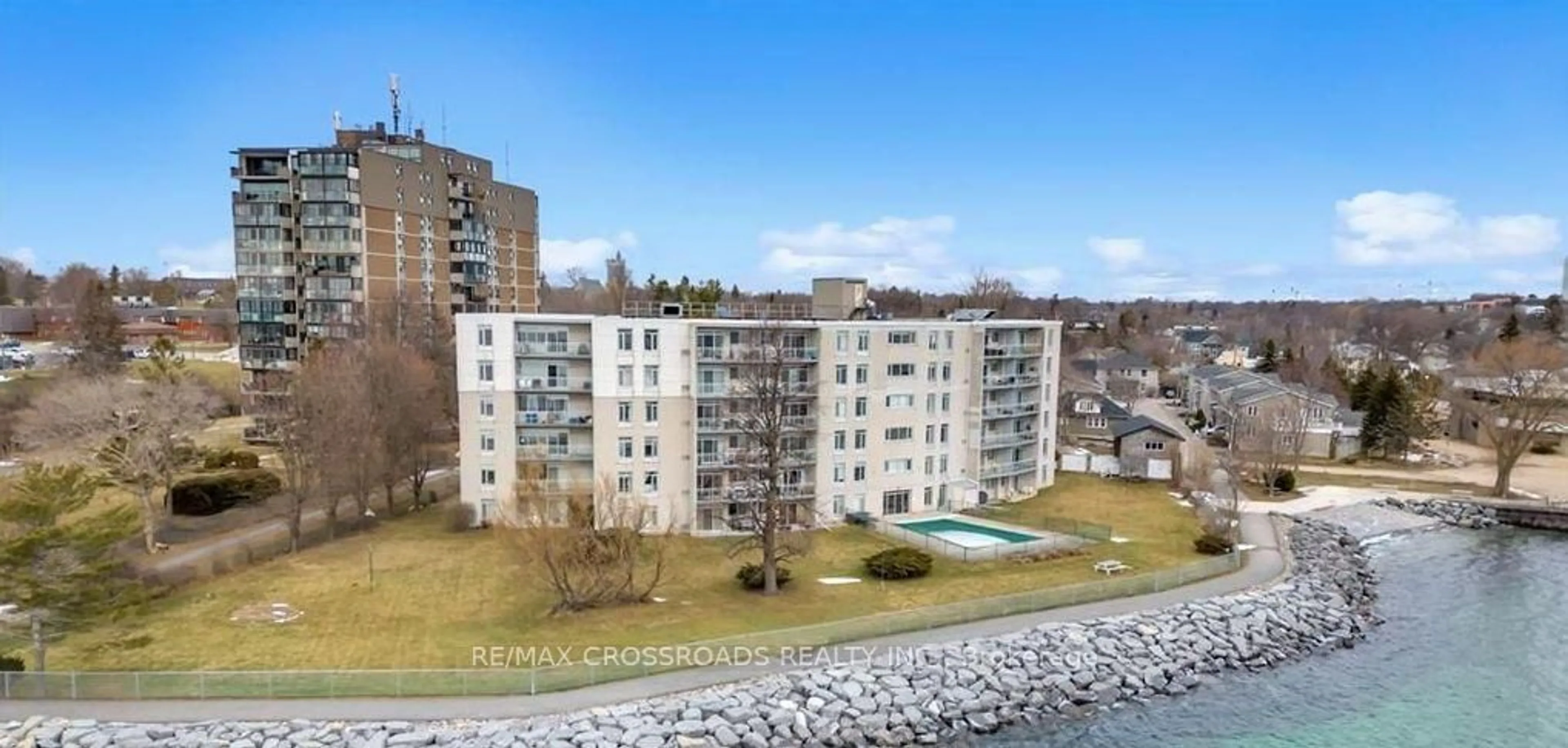 A pic from outside/outdoor area/front of a property/back of a property/a pic from drone, water/lake/river/ocean view for 1 Mowat Ave #209, Kingston Ontario K7M 1J8