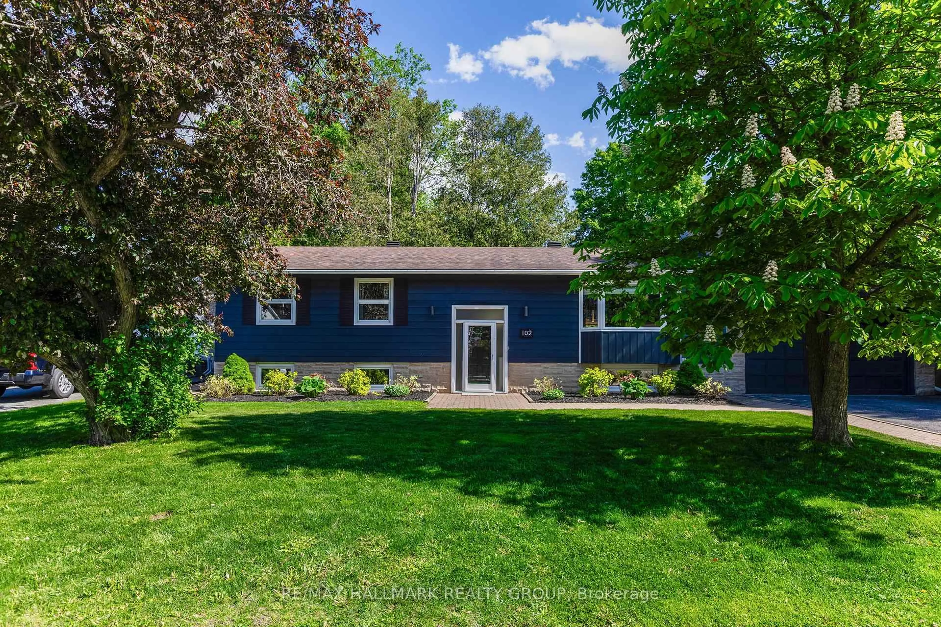 Home with vinyl exterior material, street for 102 Coburn Ave, Kanata Ontario K2L 1G3