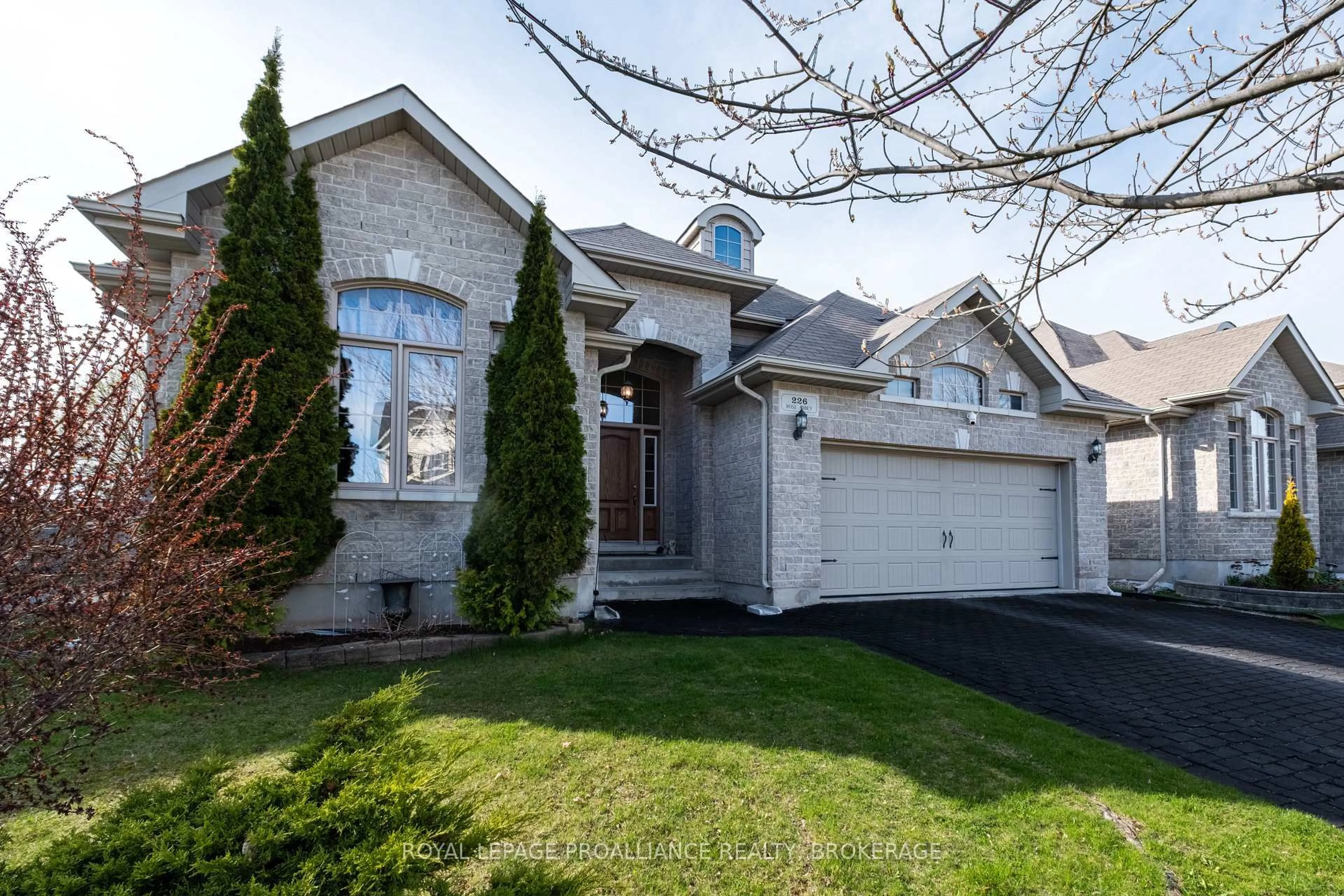 Home with brick exterior material, street for 226 Rose Abbey Dr, Kingston Ontario K7K 0A2