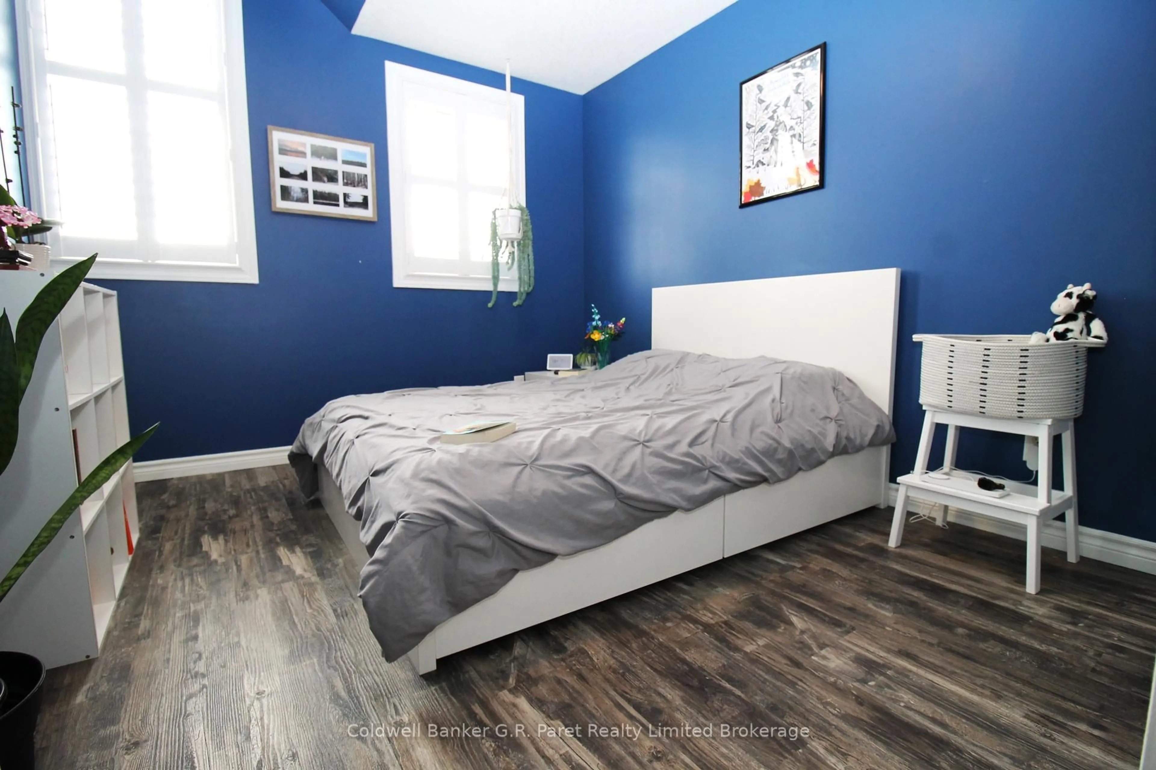 Bedroom with bed, wood/laminate floor for 1867 Waterwheel Pl, London North Ontario N5X 4P5