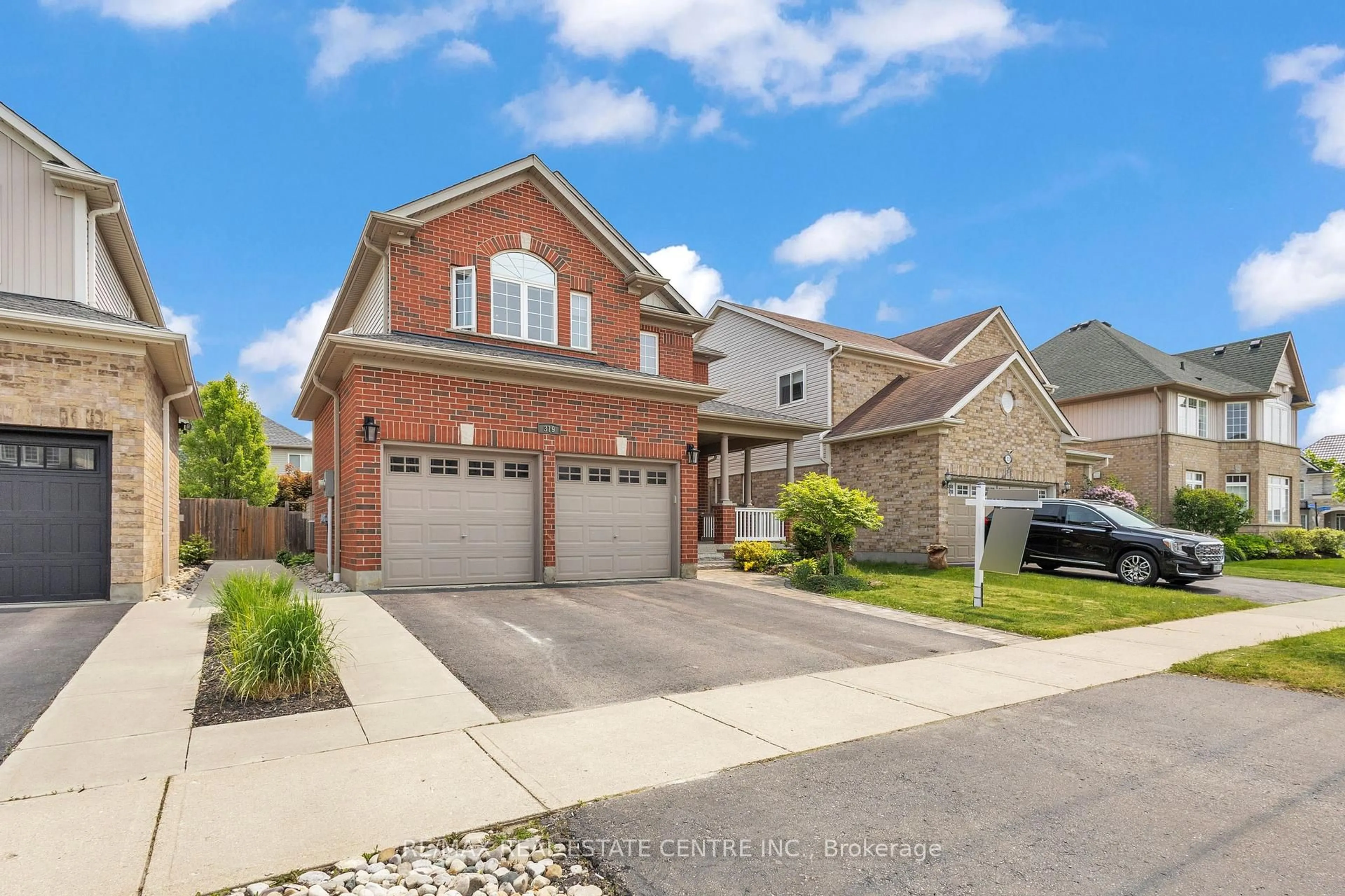 Home with brick exterior material, street for 319 Robert Ferrie Dr, Kitchener Ontario N2P 2Y7