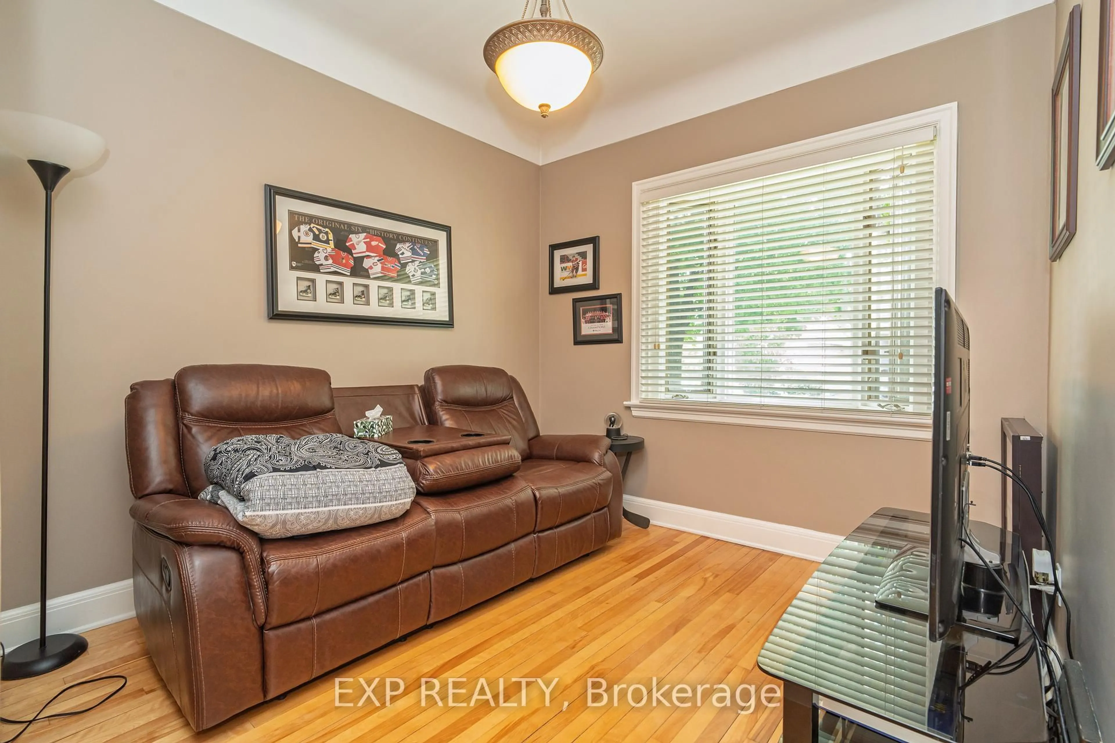 Living room with furniture, wood/laminate floor for 12 Ross Ave, Ottawa Ontario K1Y 0N3