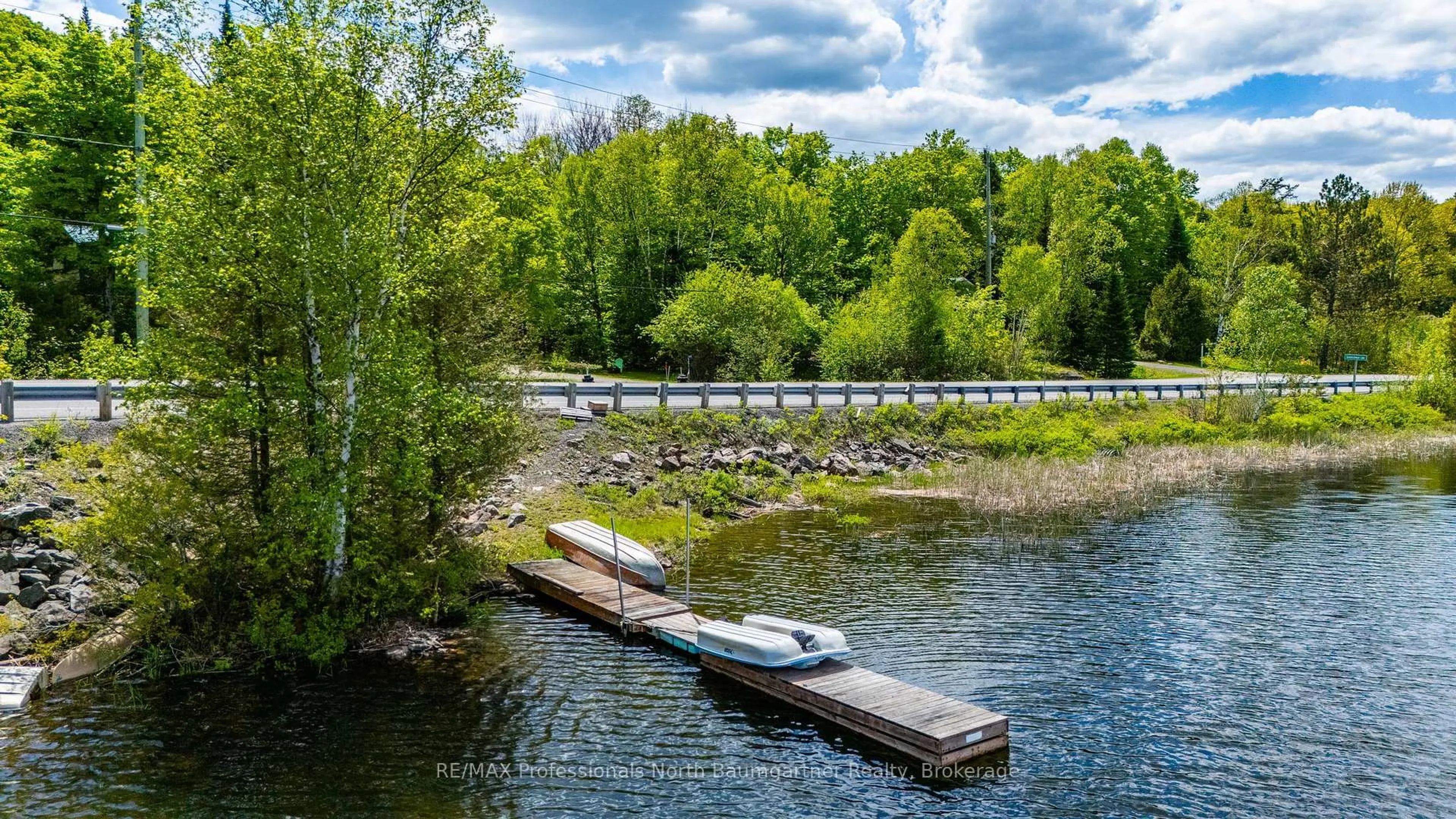 A pic from outside/outdoor area/front of a property/back of a property/a pic from drone, water/lake/river/ocean view for 18053 Highway 35, Algonquin Highlands Ontario K0M 1J2