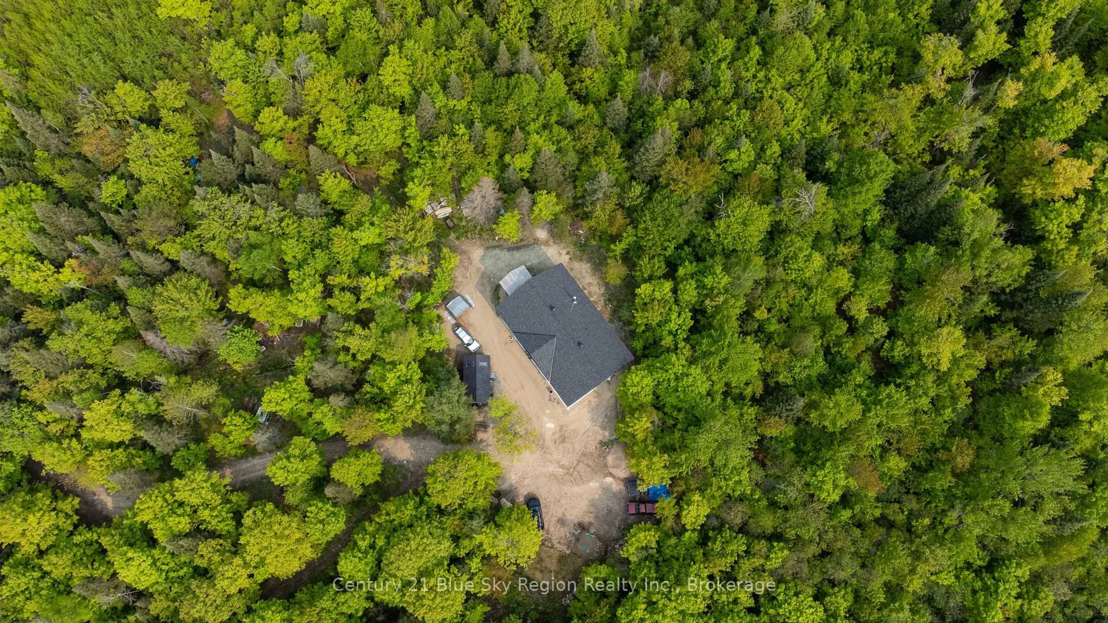 A pic from outside/outdoor area/front of a property/back of a property/a pic from drone, forest/trees view for 7700 Highway 63, North Bay Ontario P1B 8G4