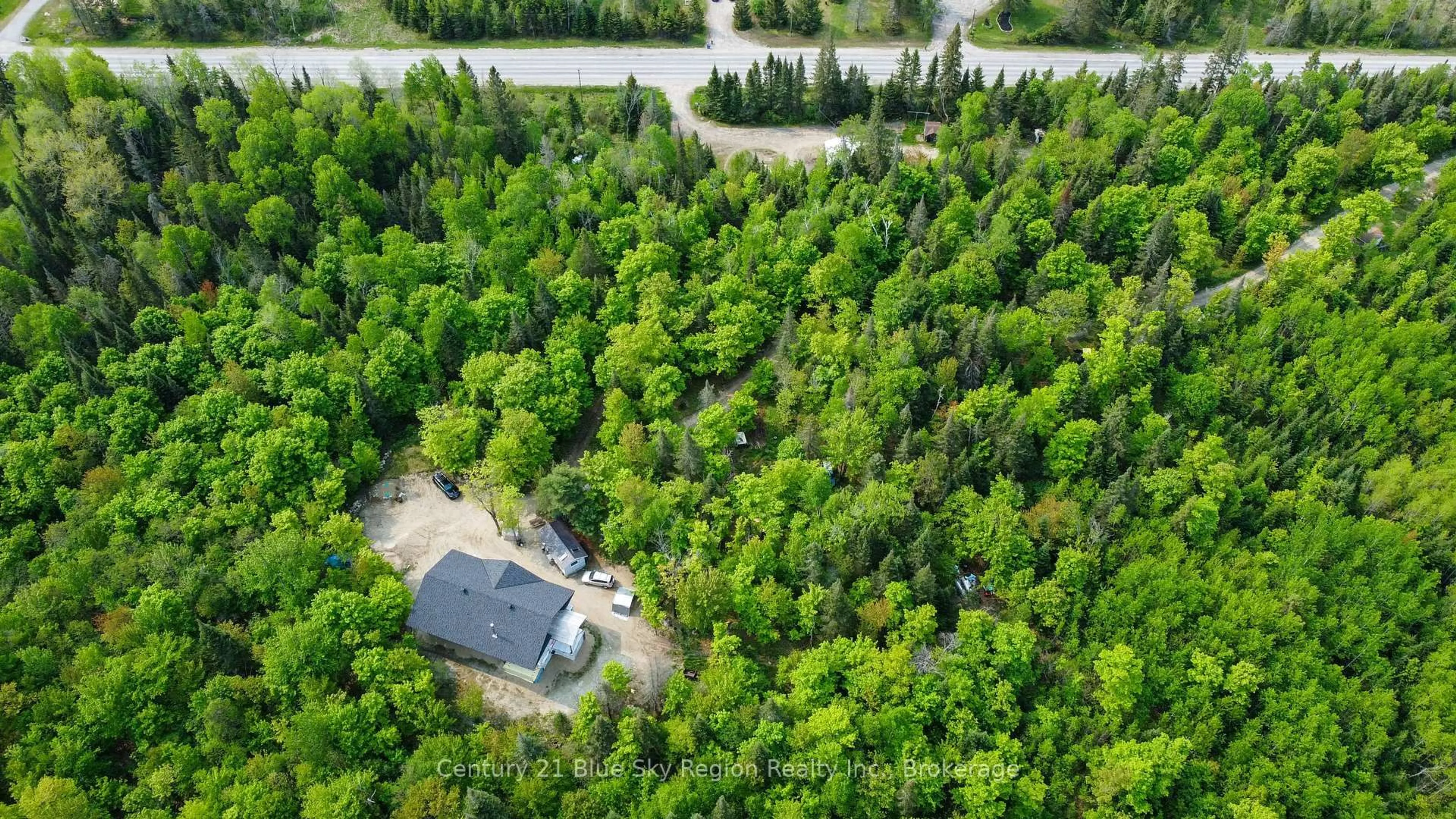 A pic from outside/outdoor area/front of a property/back of a property/a pic from drone, forest/trees view for 7700 Highway 63, North Bay Ontario P1B 8G4