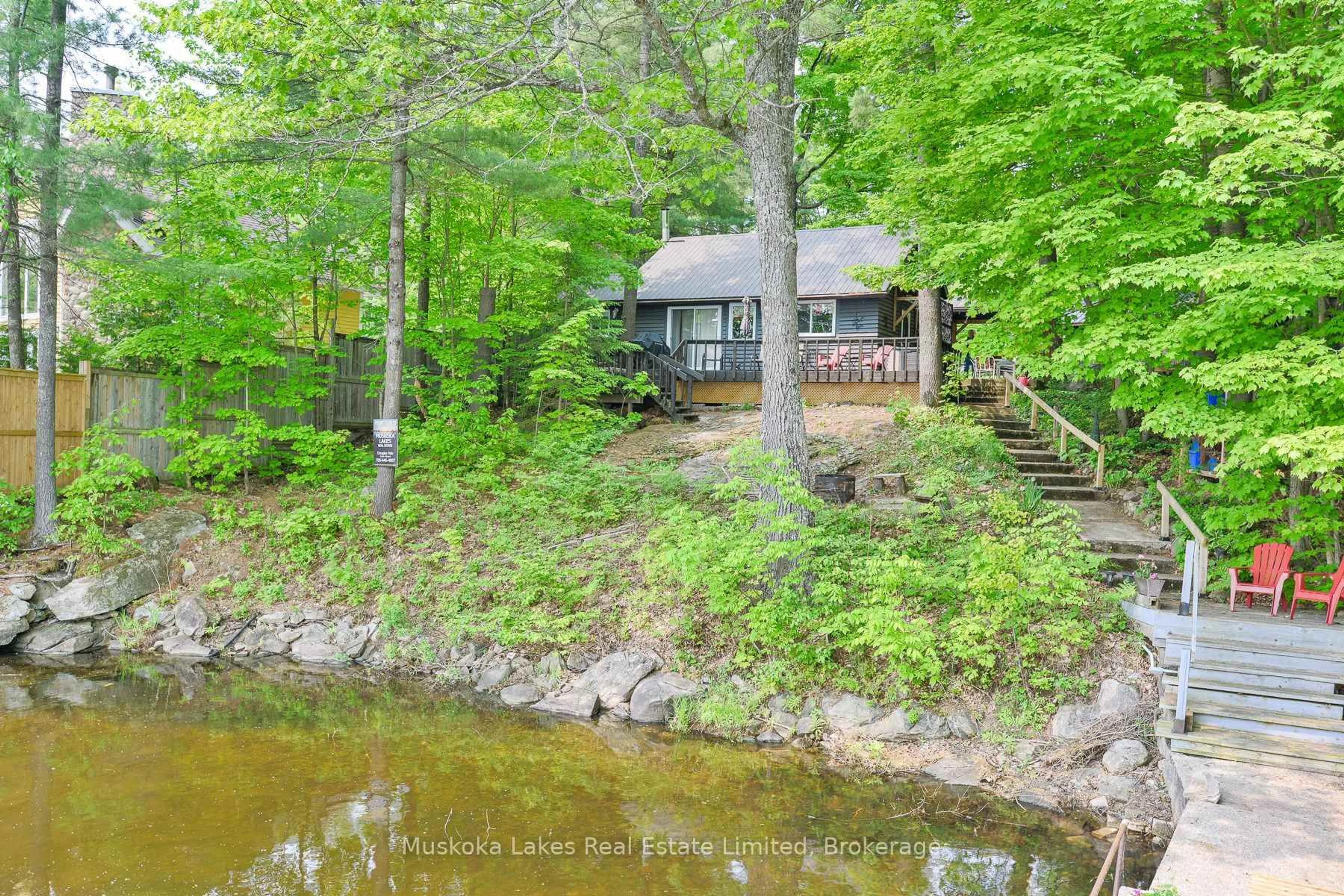 A pic from outside/outdoor area/front of a property/back of a property/a pic from drone, water/lake/river/ocean view for 1028 Cowan Park Rd, Muskoka Lakes Ontario P0B 1M0