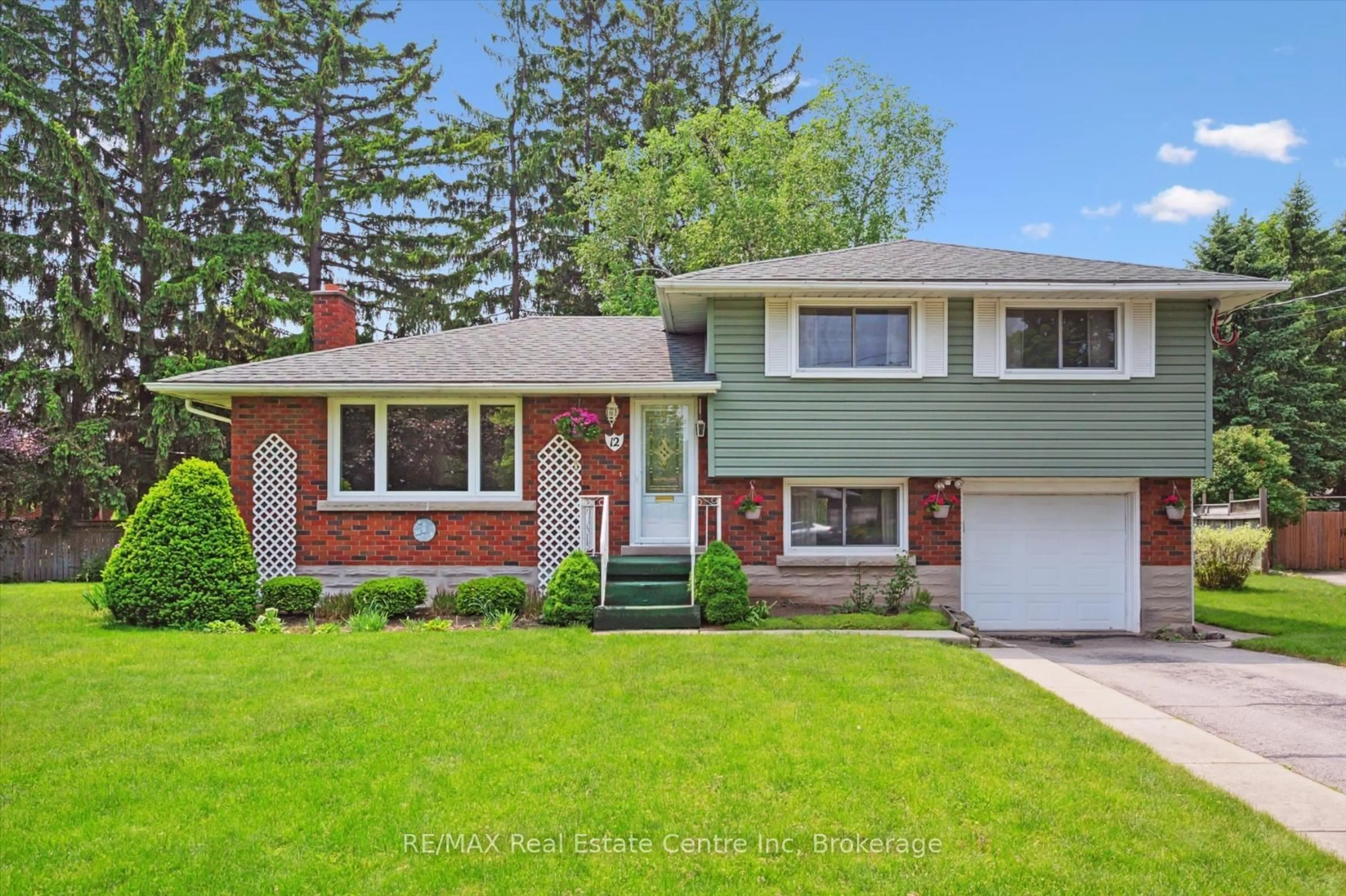 Home with vinyl exterior material, street for 12 Gladstone Ave, Guelph Ontario N1E 1L6